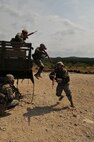 Security forces students exit a Humvee during basic combat convoy field training at Camp Bullis. Camp Bullis, a training camp located in northwest San Antonio, is used primarily as maneuvering grounds for Army, Air Force and Marine combat units. (U.S. Air Force photo/Patrick Nugent) 