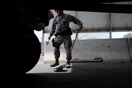 Tech. Sgt. Brian Amerault inspects the outside of a commercial truck at Lackland's Growden Gate. The Growden Gate is the commercial vehicle search area allowing trucks to enter Lackland. Sergeant Amerault is assigned to the 37th Security Forces Squadron. (U.S. Air Force photo/Staff Sgt. Desiree N. Palacios)