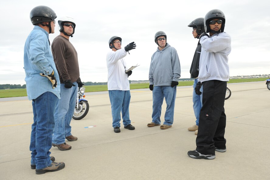 Senior Master Sgt. John Sarmento, 4th Fighter Wing motorcycle safety program manager, brief students during the basic rider's course exercise on Seymour Johnson Air Force Base, N.C., Sept. 1, 2009. Before an exercise begins, he explains and demonstrates what the students will practice for the next 30 minutes. At the end of each exercise, he answers questions and provides feedback. (U.S. Air Force photo by Airman 1st Class Whitney Lambert)