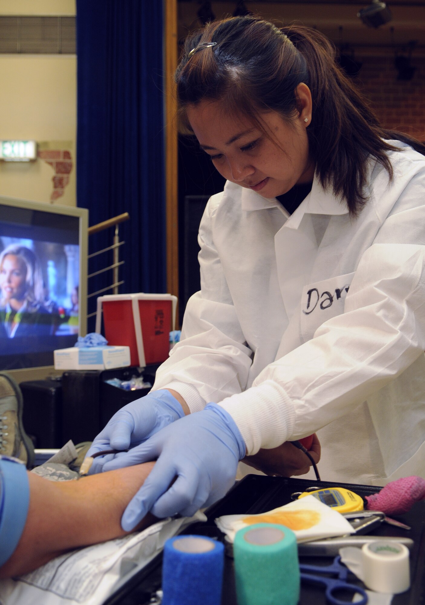 SPANGDAHLEM AIR BASE, Germany – Daryl Abiera, Armed Services Blood Bank Center – Europe, draws blood from a donor during a blood drive held at the Brick House in the community center Sept. 2. The blood drive had 71 donors, totaling 55 whole units of blood. Each unit collected can potentially save three lives. (U.S. Air Force photo/Senior Airman Benjamin Wilson)
