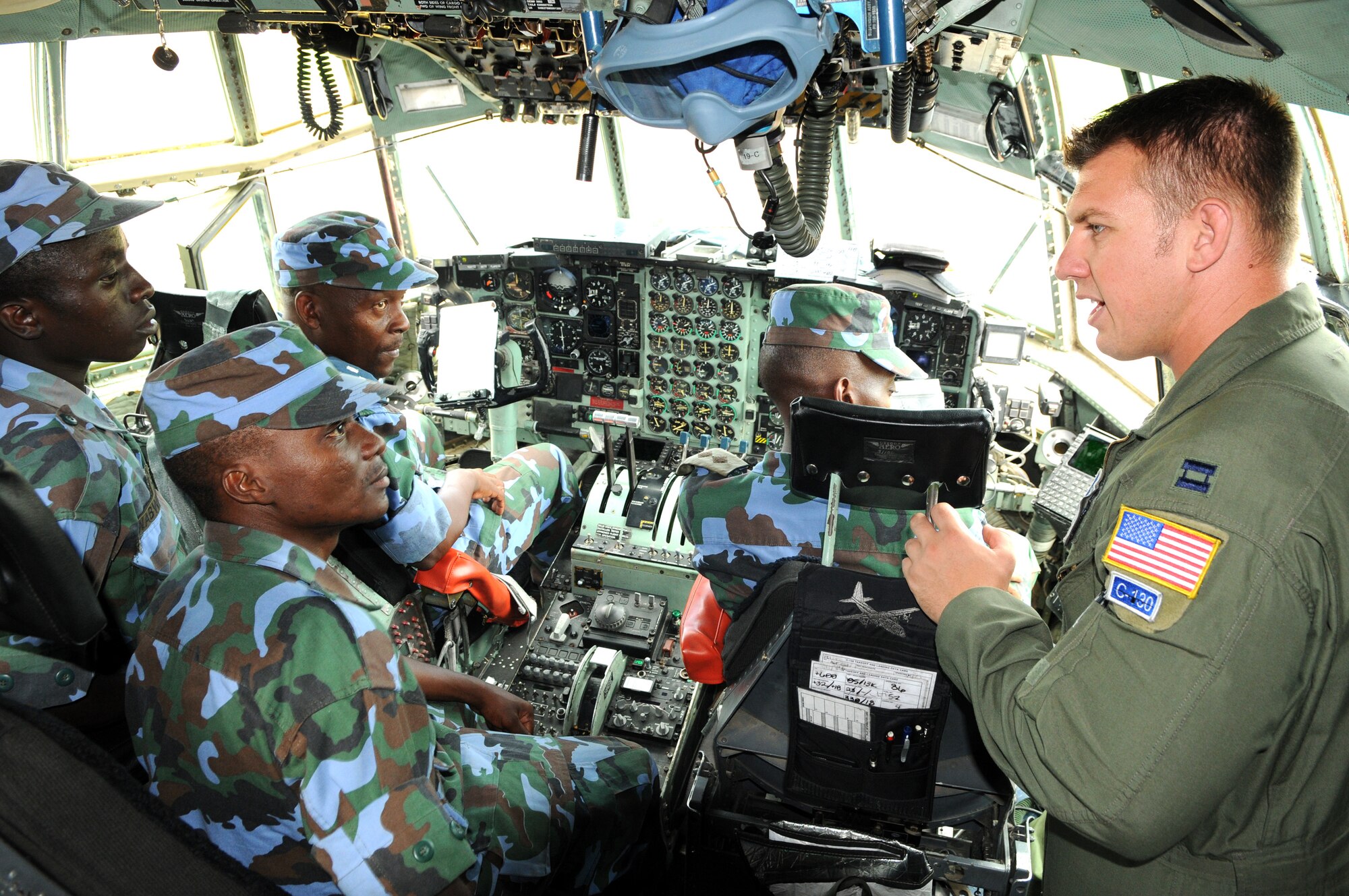 Capt. Kevin Graham, 37th Airlift Squadron pilot, gives a tour of the C-130 flight deck to members of the Ugandan Peoples Defense Force during a theater security engagement event at Entebbe, Uganda on Aug. 26. (USAF photo by Maj. Paula Kurtz) 