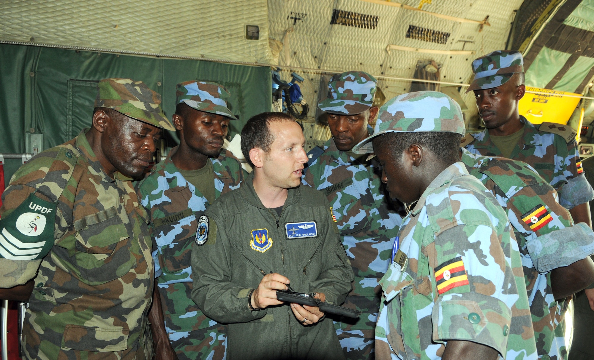 Staff Sgt. Josh Woolrich gives a tour of the U.S. Air Force C-130 to members of the Uganda Peoples Defense Force during a theater security cooperation event Aug. 26 at Entebbe Air Base, Uganda. (USAF photo by Maj. Paula Kurtz) 