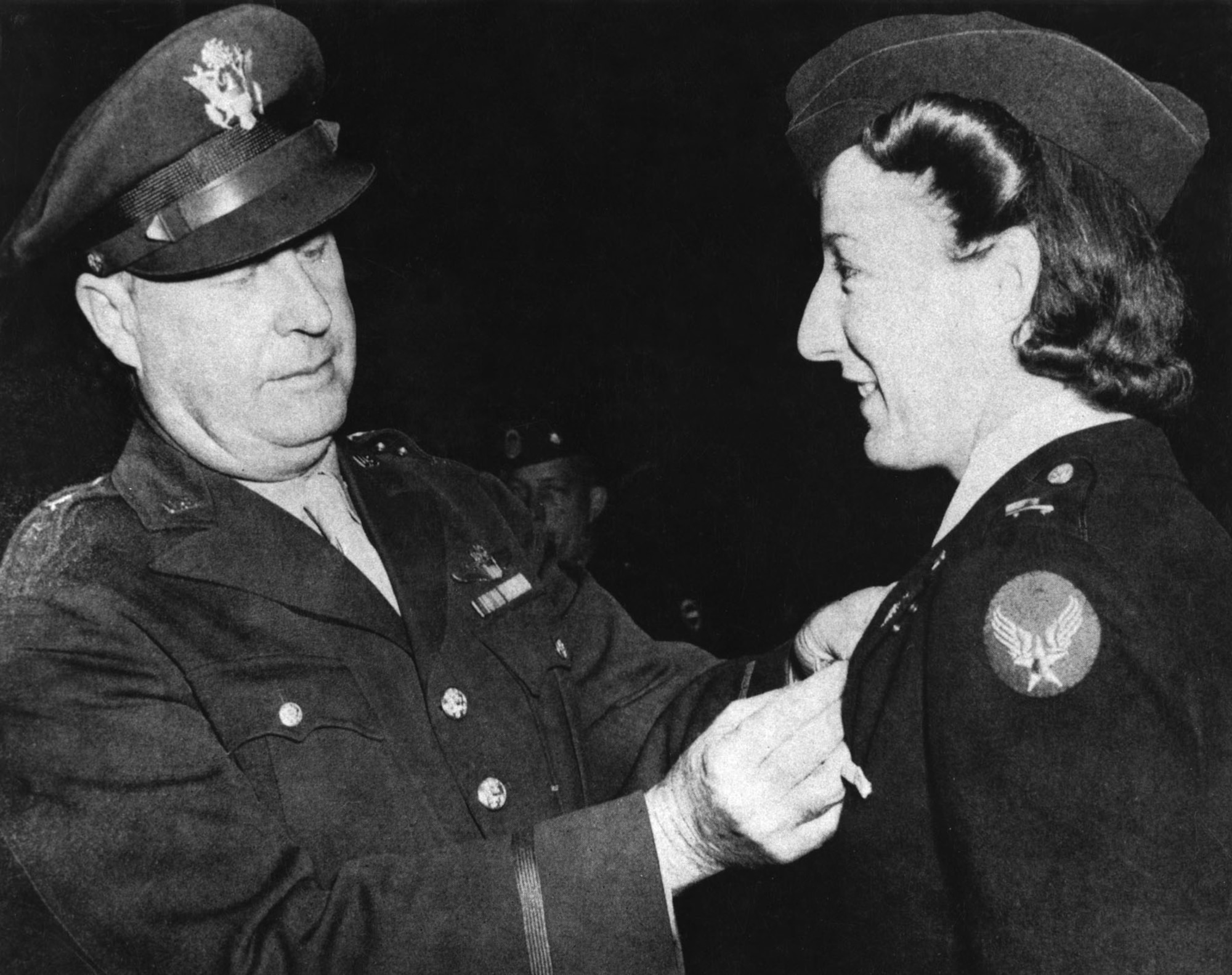 Brig. Gen. Fred W. Borum presents the Air Medal to Lt. Elsie Ott, who was the first woman to receive the Air Medal. (U.S. Air Force photo)