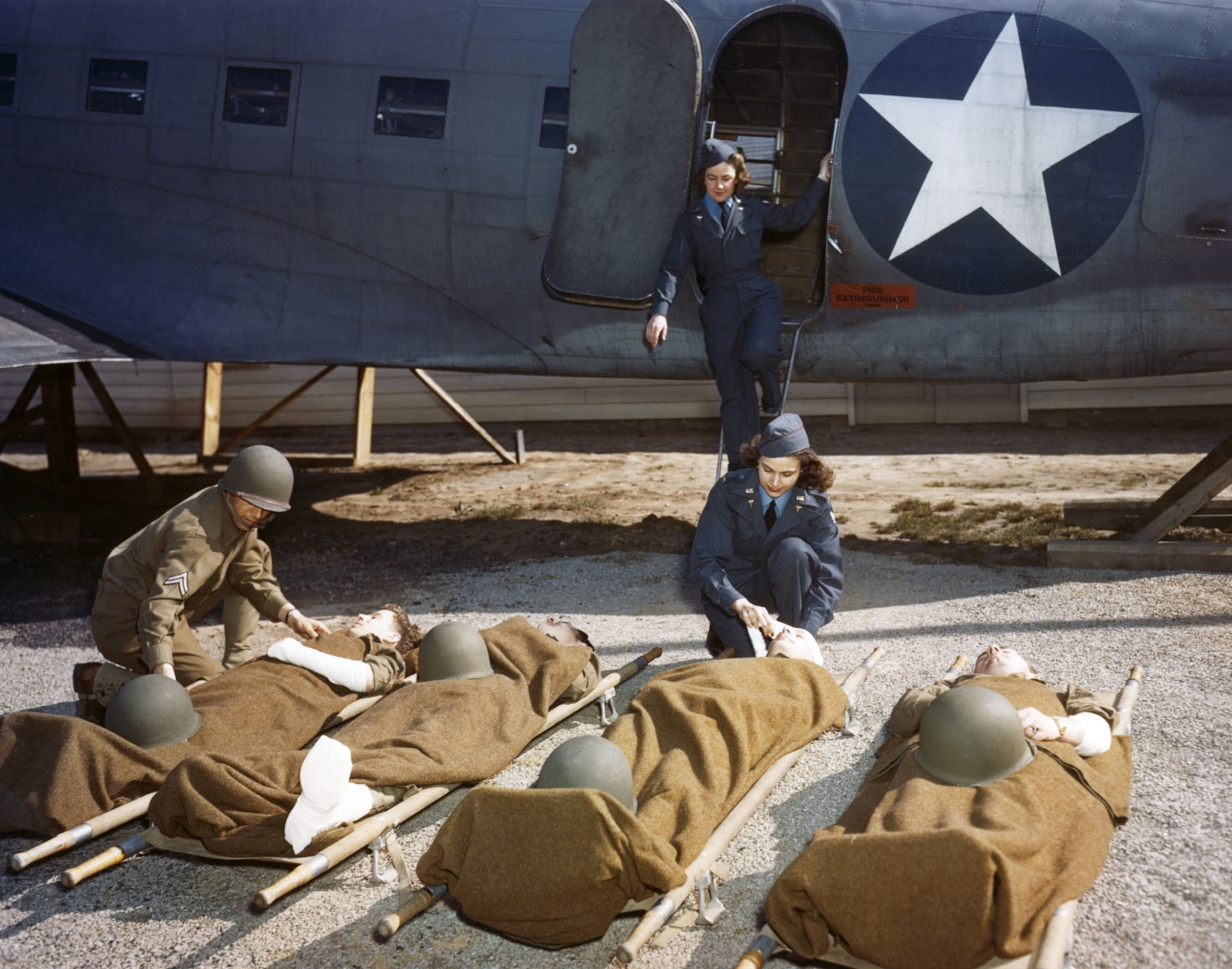 At the AAF School of Air Evacuation at Bowman Field, Ky., student flight nurses learned how to handle patients with the aid of a mock-up fuselage of a Douglas C-47 transport. (U.S. Air Force photo)