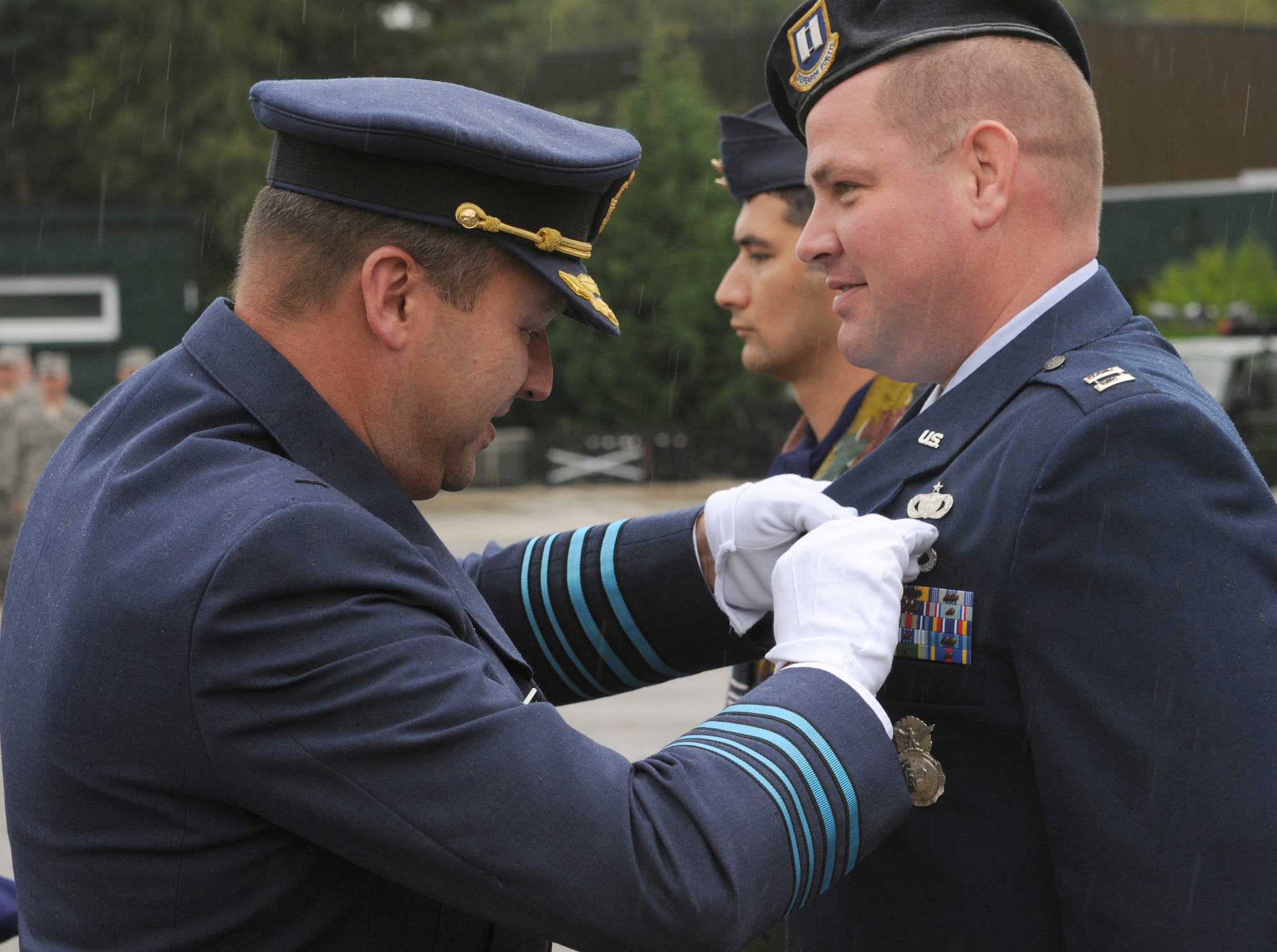 SPANGDAHLEM AIR BASE, Germany – Capt. Andrew Legault, 701st Munitions Support Squadron security forces commander, receives a Belgian Meritorious Medal from Maj. Gen Claude Van De Voorde, Belgian air force 10th Tactical Wing commander, during the 10th TW change of command ceremony Sept. 1. Captain Legault received the medal for outstanding efforts resulting in excellent ratings during the most recent weapons inspection at Kleine Brogel Air Base, Belgium. (U.S. Air Force photo/Senior Airman Benjamin Wilson)
