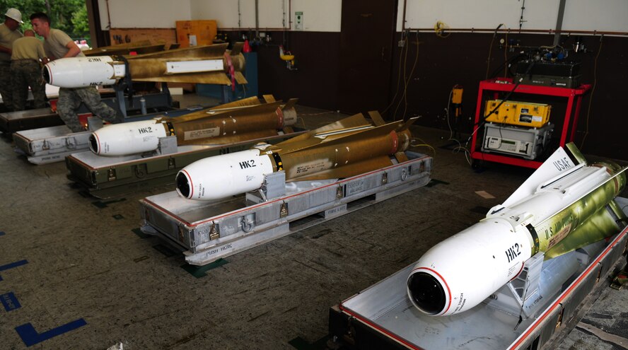 Members of the 86th Munitions Squadron and an Air Force Reserve Ammunition Team prepare AGM-65 Maverick H-and-K-model missile systems for upgrades Aug. 11, 2009, Ramstein Air Base, Germany. A Maverick Systems Program Office team from Raytheon Missile Systems enhanced the missiles with a new software circuit card which allows for more accuracy and adds an abort code for pilots. (U.S. Air Force photo by Staff Sgt. Jocelyn Rich)