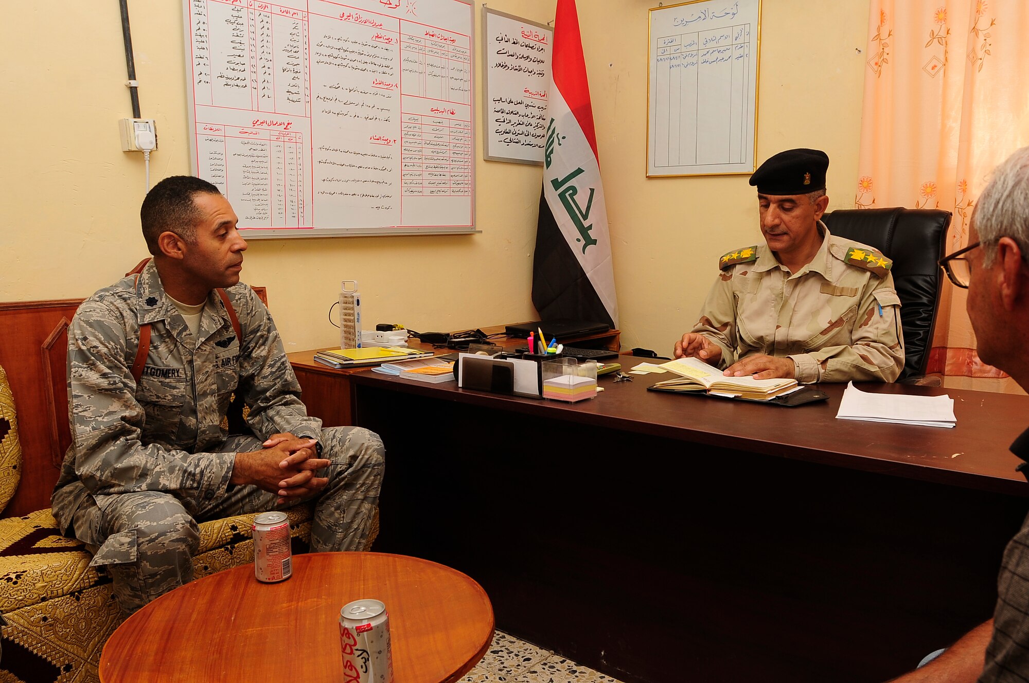 ALI BASE, Iraq – U.S. Air Force Lt. Col. Bradford Montgomery, 407th Expeditionary Force Support Squadron commander, sits down with Iraqi Army Col. Muhammad Abd Al-Muhssan Khalaf Mahd to discuss quality of life issues facing the Iraqi soldiers at Camp Mittica, Aug. 29, 2009. Colonel Montgomery, deployed from Naval Air Station Joint Reserve Base Ft. Worth, Texas, and Airmen from the 407th EFSS donated more than 70 bed frames and mattresses to the Iraqi Army assigned to Camp Mittica.  Prior to the donation Iraqi Soldiers slept on the floor or rooftops of their facilities using only a thin pad as their bed. (U.S. Air Force photo / Airman 1st Class Tony R. Ritter) 