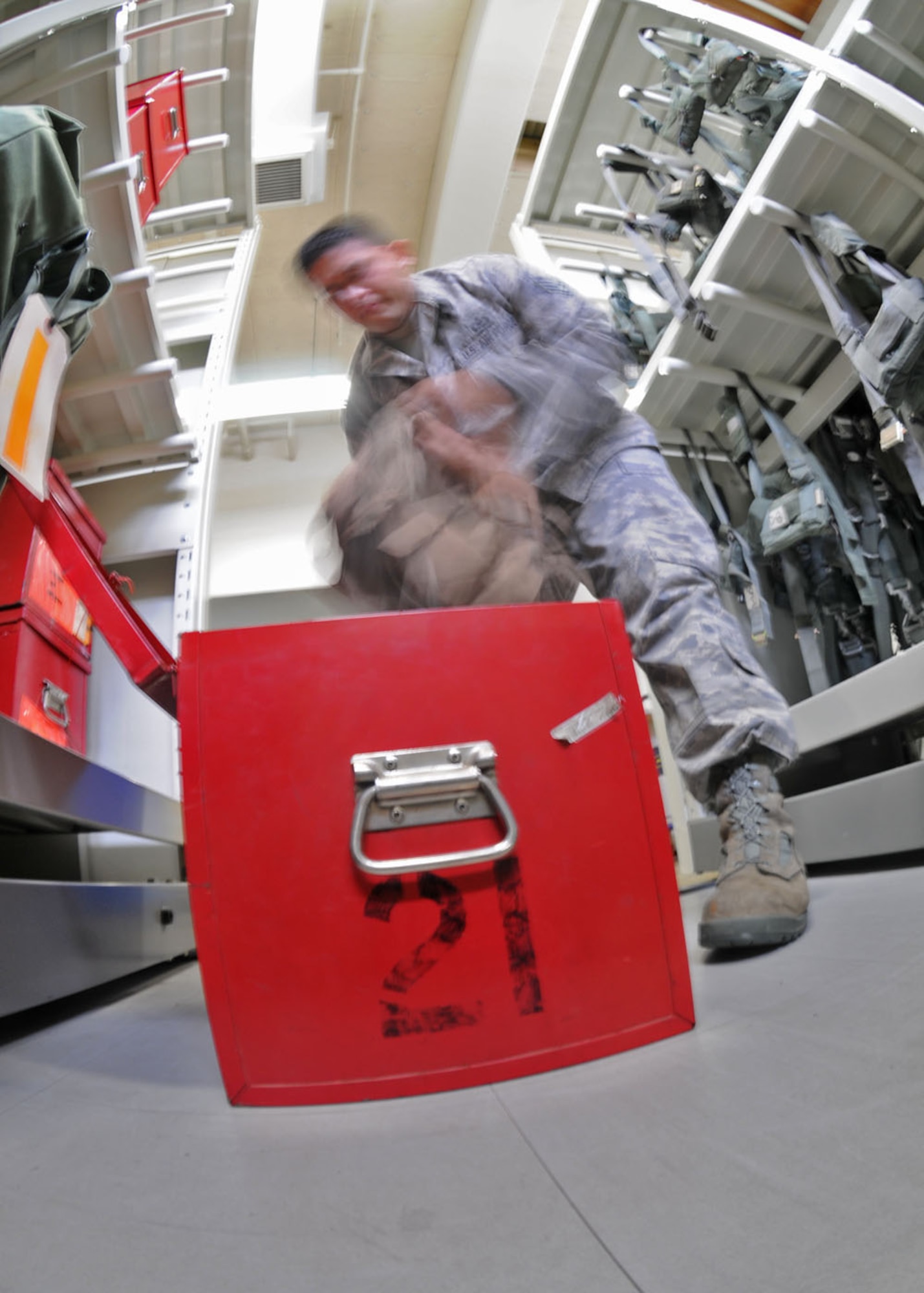 YOKOTA AIR BASE, Japan -- Staff Sgt. Jose Aguilar, 374th Operations Support Squadron aircrew flight equipment craftsman, verifies aircrew survival vest have all the required survival equipment Sept. 2. In case of an emergency landing in unknown terrain the survival vest carries items such as a compass, knife, first-aid kit among other useful survival equipment. Aircrew flight equipment  technicians ensure life-saving survival equipment used by aircrew members is properly functioning by inspecting and maintaining items such as flight helmets, oxygen masks, parachutes, flotation devices, survival kits, helmet mounted devices, aircrew night vision and other ocular systems. They also check anti-gravity garments, aircrew eye and respiratory protective equipment, chemical biological protective oxygen masks and coveralls, and other types of aircrew flight equipment and aircrew chemical defense systems. (U.S. Air Force photo/Staff Sgt. Veronica Pierce)