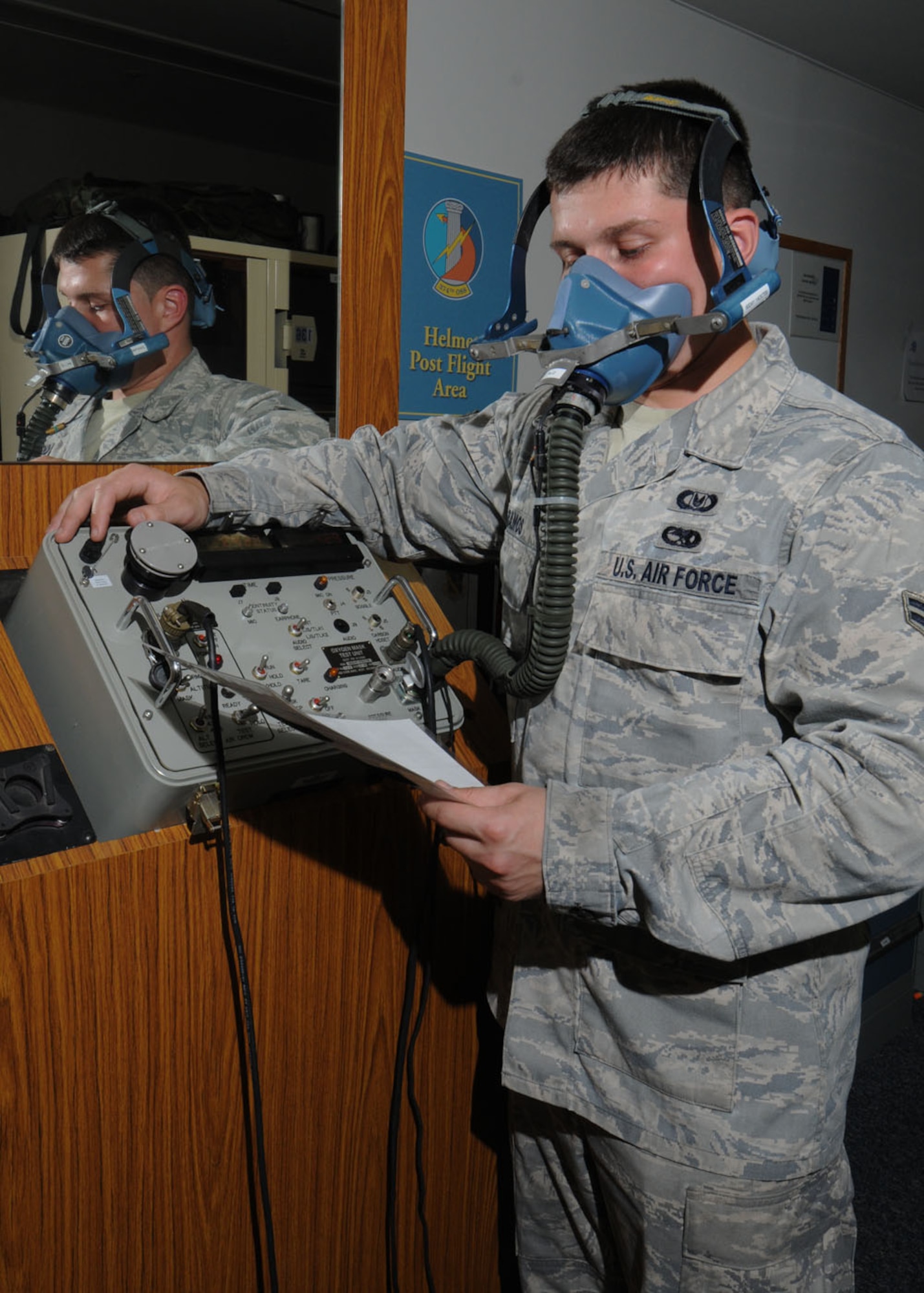 YOKOTA AIR BASE, Japan -- Airman 1st Class Matthew Ramos, 374th Operations Support Squadron aircrew flight equipment apprentice, inspects a mask used by Yokota aircrew members during in-flight emergencies Sept. 2. Aircrew flight equipment  technicians ensure life-saving survival equipment used by aircrew members is properly functioning by inspecting and maintaining items such as flight helmets, oxygen masks, parachutes, flotation devices, survival kits, helmet mounted devices, aircrew night vision and other ocular systems. They also check anti-gravity garments, aircrew eye and respiratory protective equipment, chemical biological protective oxygen masks and coveralls, and other types of aircrew flight equipment and aircrew chemical defense systems. (U.S. Air Force photo/Staff Sgt. Veronica Pierce) 