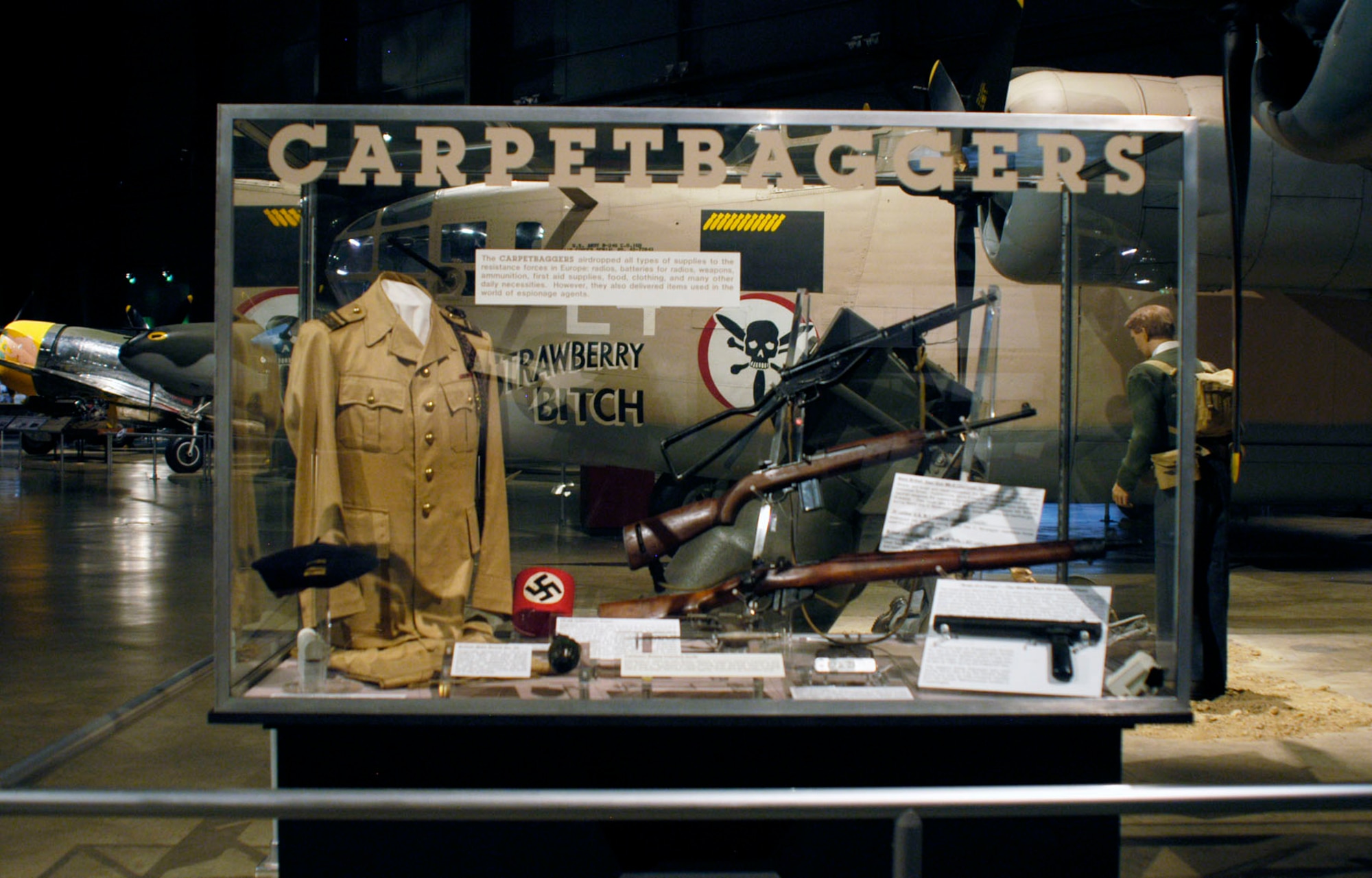 DAYTON, Ohio -- Operation CARPETBAGGER exhibit in the World War II Gallery at the National Museum of the U.S. Air Force. The CARPETBAGGERS dropped all types of supplies to the resistance forces in Europe: radios, batteries for radios, weapons, ammunition, first aid supplies, food, clothing, and many other daily necessities. However, they also delivered items used in the world of espionage agents. (U.S. Air Force photo)