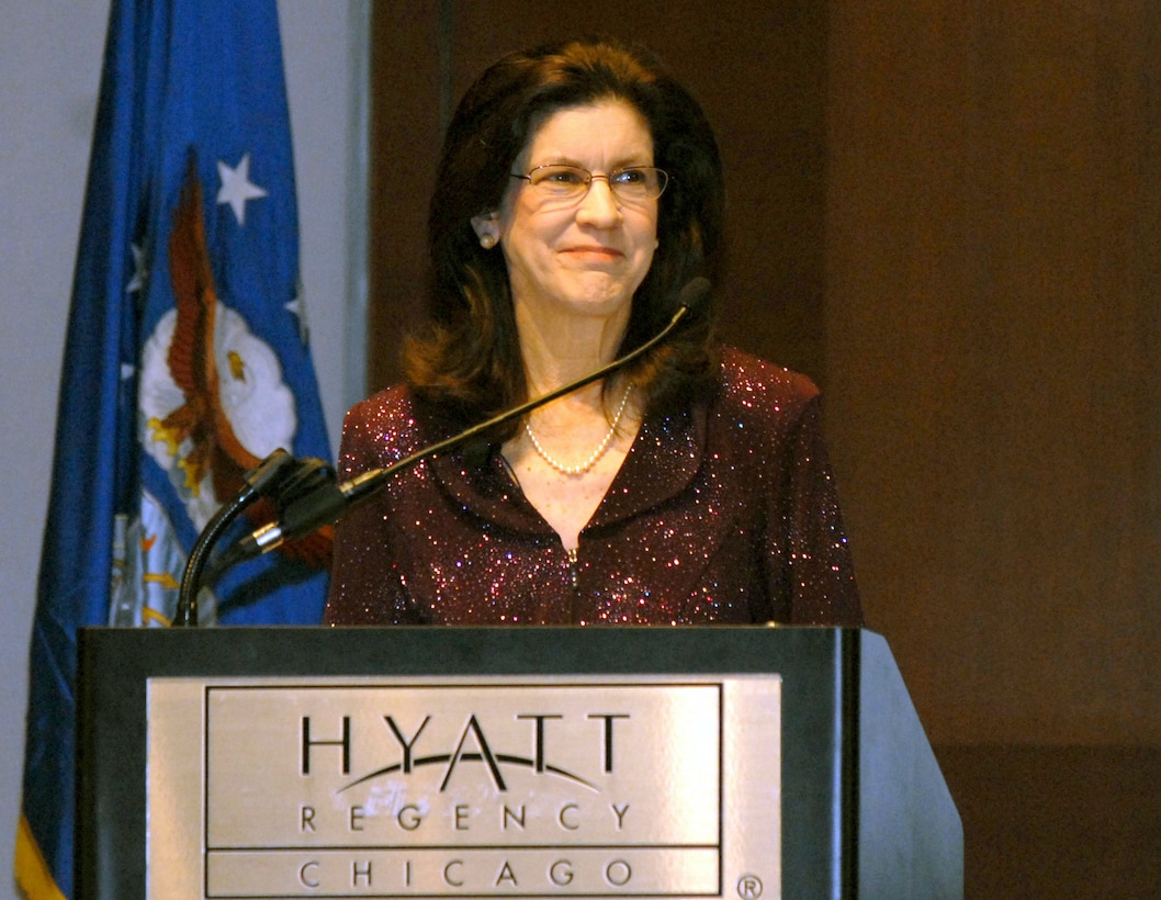 Christi Ham, wife of Army Gen. Carter F. Ham, commander of U.S. Army Europe and 7th Army, smiles at a comment her husband made during their joint keynote address at the Defense Department’s Joint Family Readiness Conference in Chicago, Sept. 1, 2009. 