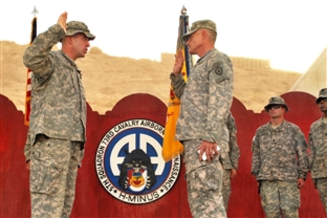 U.S. Army Maj Gen. Robert L. Calsen Jr., right, commanding general of Multinational Division North, recites the oath of office to Lt. Col. Dave Buckingham during his promotion ceremony to the rank of colonel on Combat Outpost Cashe South, Iraq, Sept. 1, 2009. Buckingham commands the 82nd Airborne Division's 5th Squadron, 73rd Cavalry Regiment, 3rd Brigade Combat Team, Multinational Division Bagdad.