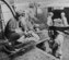 Flight nurse Lt. Mae Olson takes the name of a wounded American soldier being placed aboard a C-47 for air evacuation from Guadalcanal in 1943. Due to such factors as noise, vibration, and the risk of hypoxia, only very stable patients were able to be transported at this time. (U.S. Air Force photo)