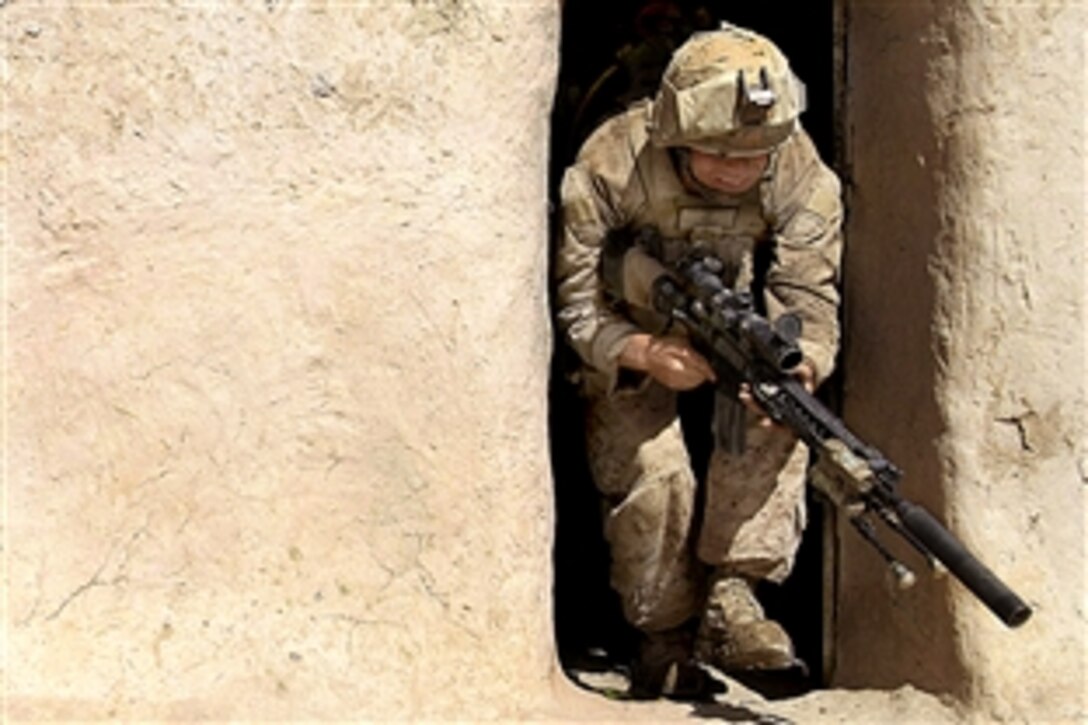 U.S. Marine Corps Lance Cpl. Reggie Reinsburg clears a compound during a patrol in Helmand province's Nawa district, Afghanistan, Aug. 29, 2009. Reinsburg is assigned to Alpha Company, 1st Battalion, 5th Marine Regiment, Regimental Combat Team 3, which conducts patrols in the southern part of Nawa.