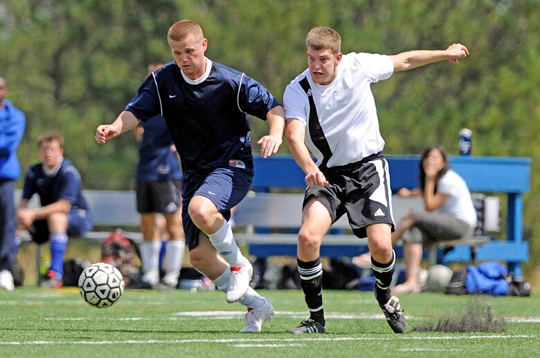 Jonathan "Jonny" Walker (right) tries to gain position on Air Force Academy's Brendan Victory during an Academy victory over F.E. Warren Air Force Base, Wyo., in a regional intramural soccer tournament Aug. 29, 2009. Victory put three in the net for the Academy through the course of the Rocky Mountain Soccer Championship tournament. (U.S. Air Force photo/Mike Kaplan)