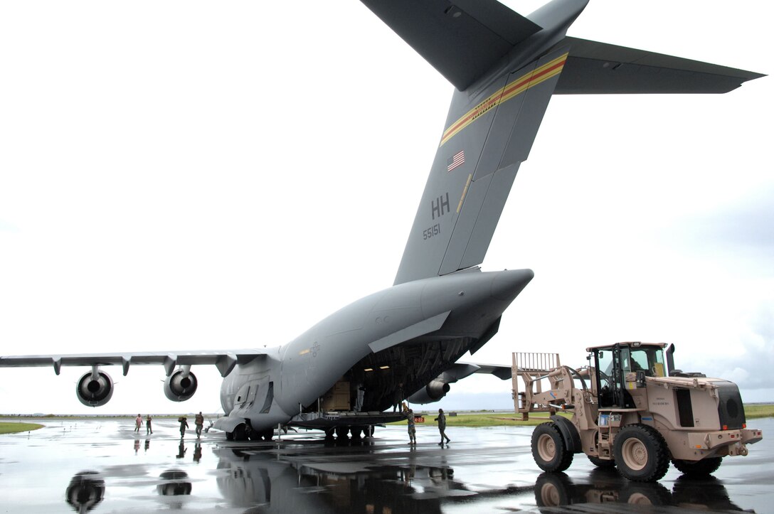 Airmen unload a C-17 Globemaster III from the 15th Airlift Wing at Hickam Air Force Base, Hawaii, during the Humanitarian Assistance Rapid Response Team validation exercise Sept. 2, 2009 on Chuuk in the Federated States of Micronesia. The HARRT is the Air Force's new expeditionary medical capability designed to deploy within 24 hours of notice during disaster relief operations. The team can set up a fully-operational medical clinic within six hours after landing and treat 350 to 500 patients per day. (U.S. Air Force photo/Capt. Andrew Hoskinson)
