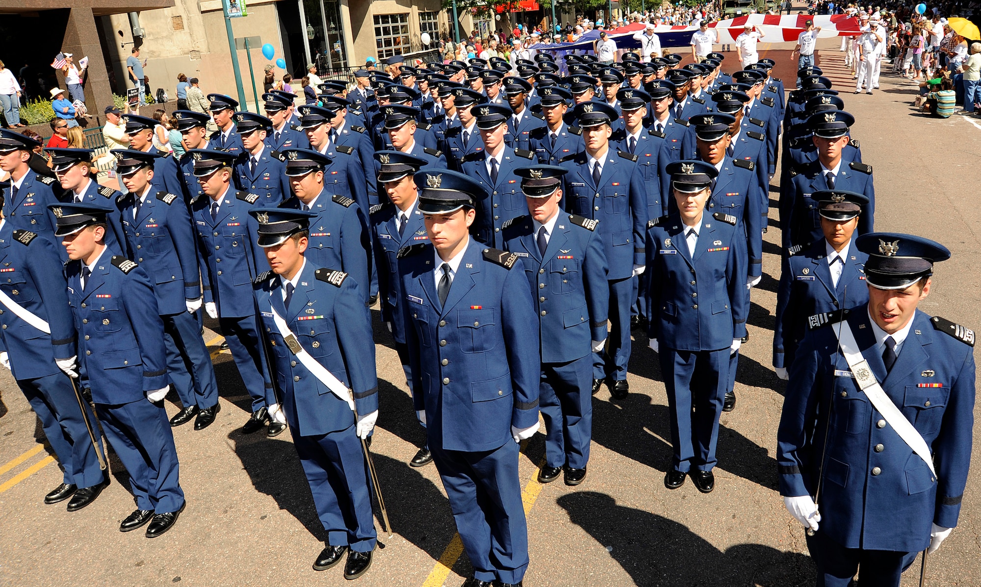 Air Force Academy Cadet 1st Class Matthew Deming issues commands to Cadet Squadron 38 during the Red, White and Brave Parade in downtown Colorado Springs, Colo., Aug. 29, 2009. Cadet Squadron 38 represented the Academy's Cadet Wing during the parade. Also president were the Academy Honor Guard, "The Bird," and varsity cheerleaders and athletes. (U.S. Air Force photo/Rachel Boettcher)