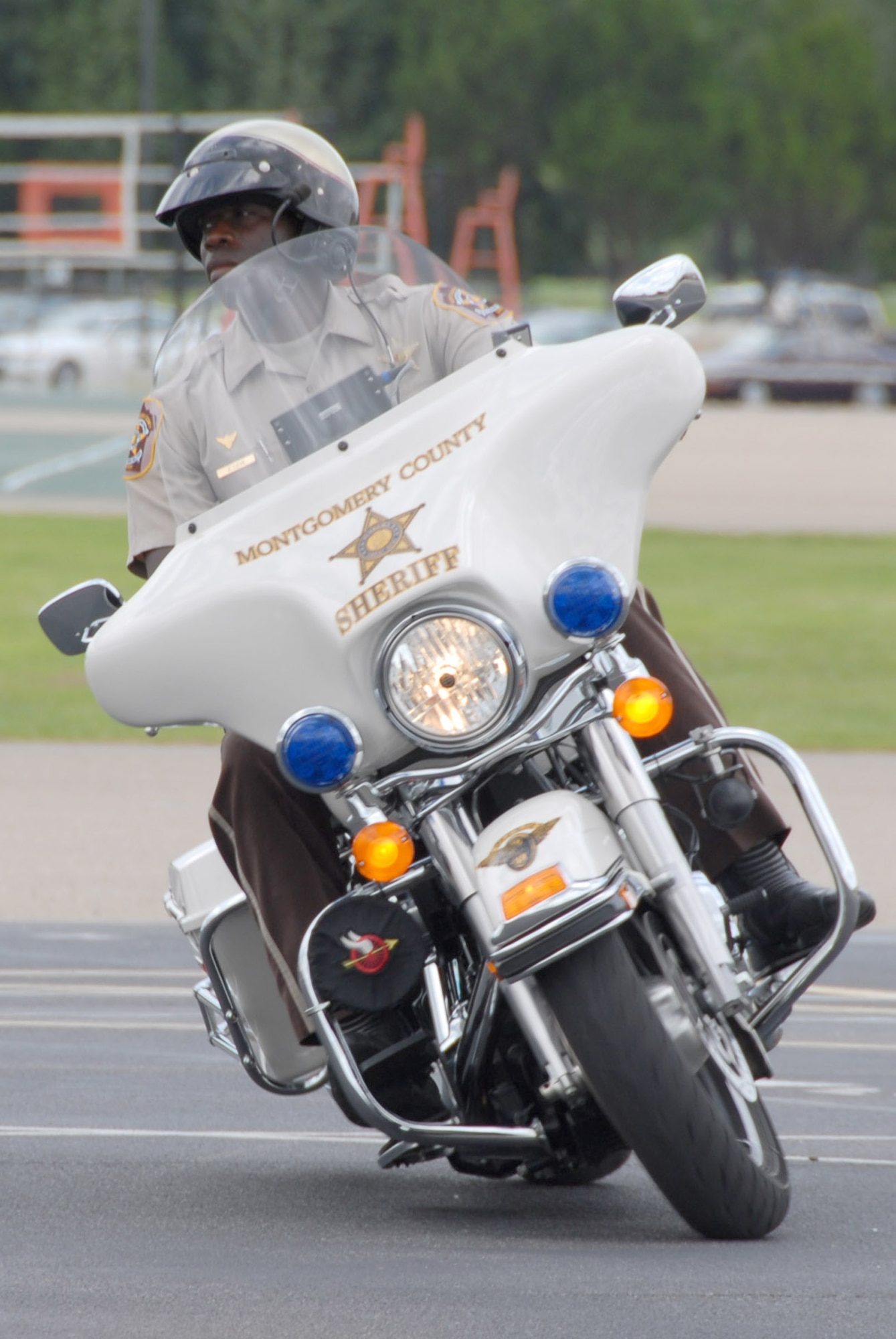 Montgomery County Sheriff's Office deputy Joe Love rides the "Intersection" course that is part of the training MCSO motorcycle officers take. Deputies Love and Gil Robinson set up the course at the rally as a demonstration for those attending the event. (U.S. Air Force photo/Jamie Pitcher)