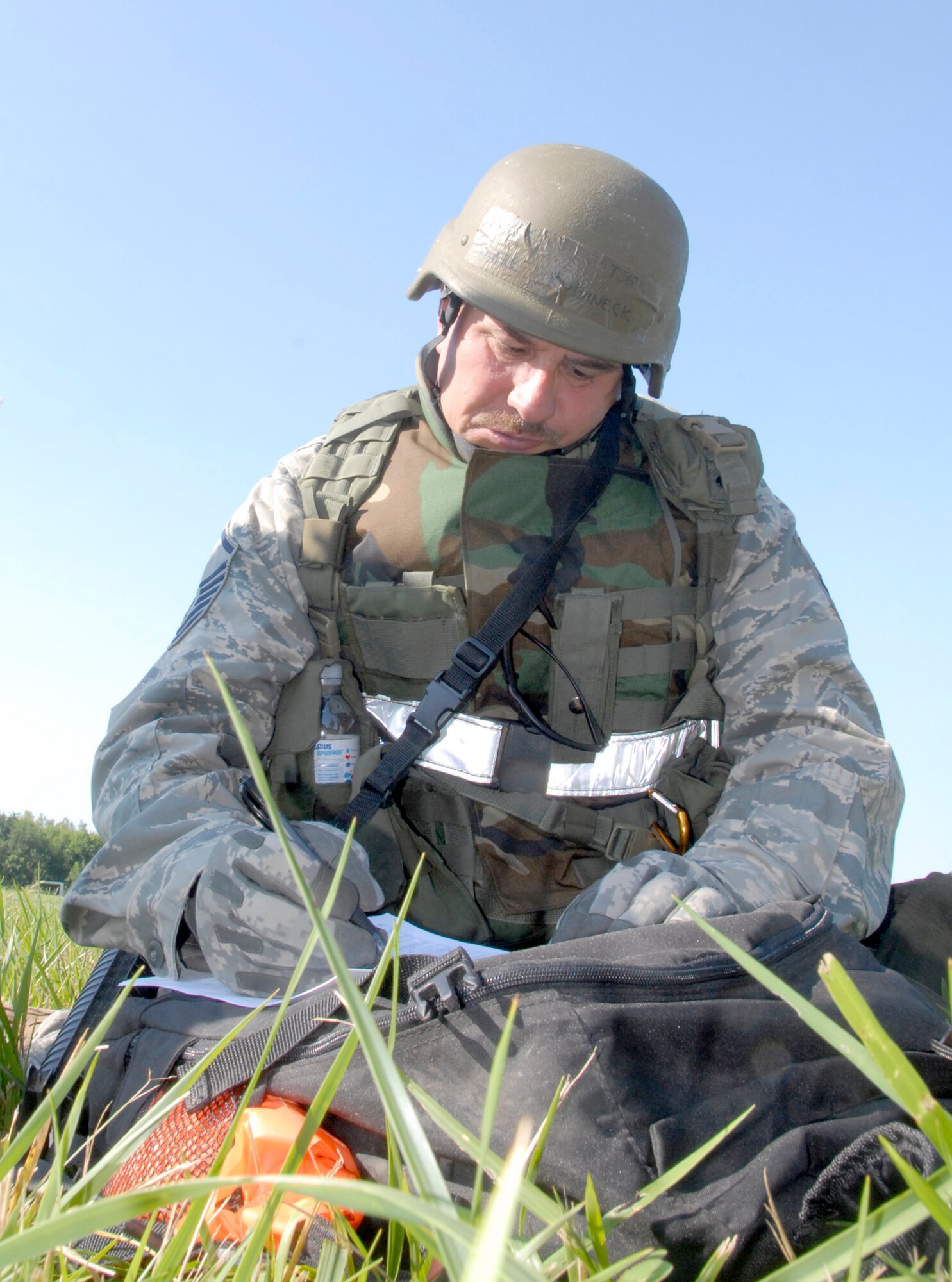 Master Sgt. Mark Kuhaneck, 442nd Civil Engineer Squadron, fills out a report following PAR and Sweep team exercises held during the August Unit Training Assembly.  Sergeant Kuhaneck, a reservist in the 442nd Fighter Wing, is preparing, along with the rest of the wing, for an operational readiness inspection in October.  The 442nd is based at Whiteman Air Force Base, Mo.  (U.S. Air Force photo/Master Sgt. Bill Huntington)