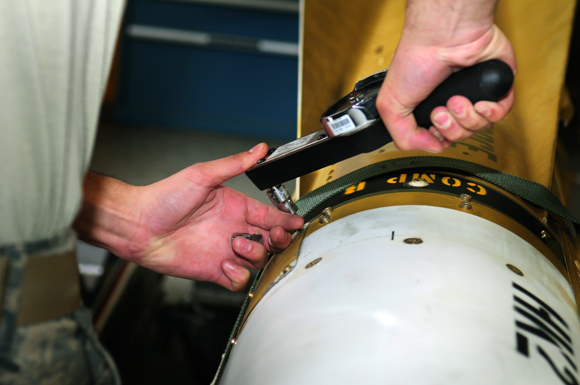 A member from the 86th Munitions Squadron removes the guidance control section of an AGM-65 Maverick missile system for upgrades Aug. 11, 2009 at Ramstein Air Base at Germany. By July 2011, more than 2,000 AGM-65 Maverick H and K models will have been updated across the Air Force, saving the Air Force $42.8 million. (U.S. Air Force photo/Staff Sgt. Jocelyn Rich) 