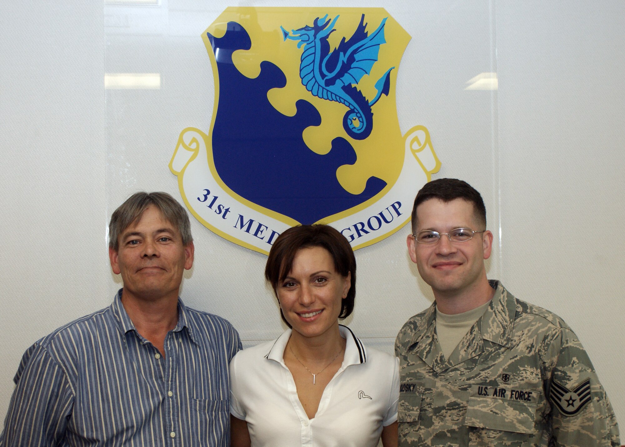 Jim Hoppe, (left), and Staff Sgt. Joshua McClosky, (right) both from the 31st Medical Support Squadron and Manuela Solda, from the 31st Medical Group are the most recent Aviano's Finest selectees for Sept. 4, 2009.  Mr. Hoppe was recognized in the U.S. civilian category, Signora Solda was recognized in the Italian civilian category, and Sergeant McClosky was recognized in the military category. (Courtesy photo)