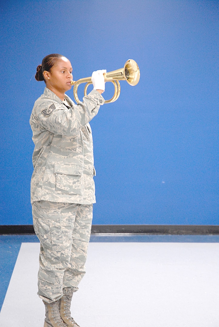 Staff Sgt. Ronetta Jones, a 12th Force Support Squadron ceremonial guardsman, prepares to play "Taps" during a  routine practice.