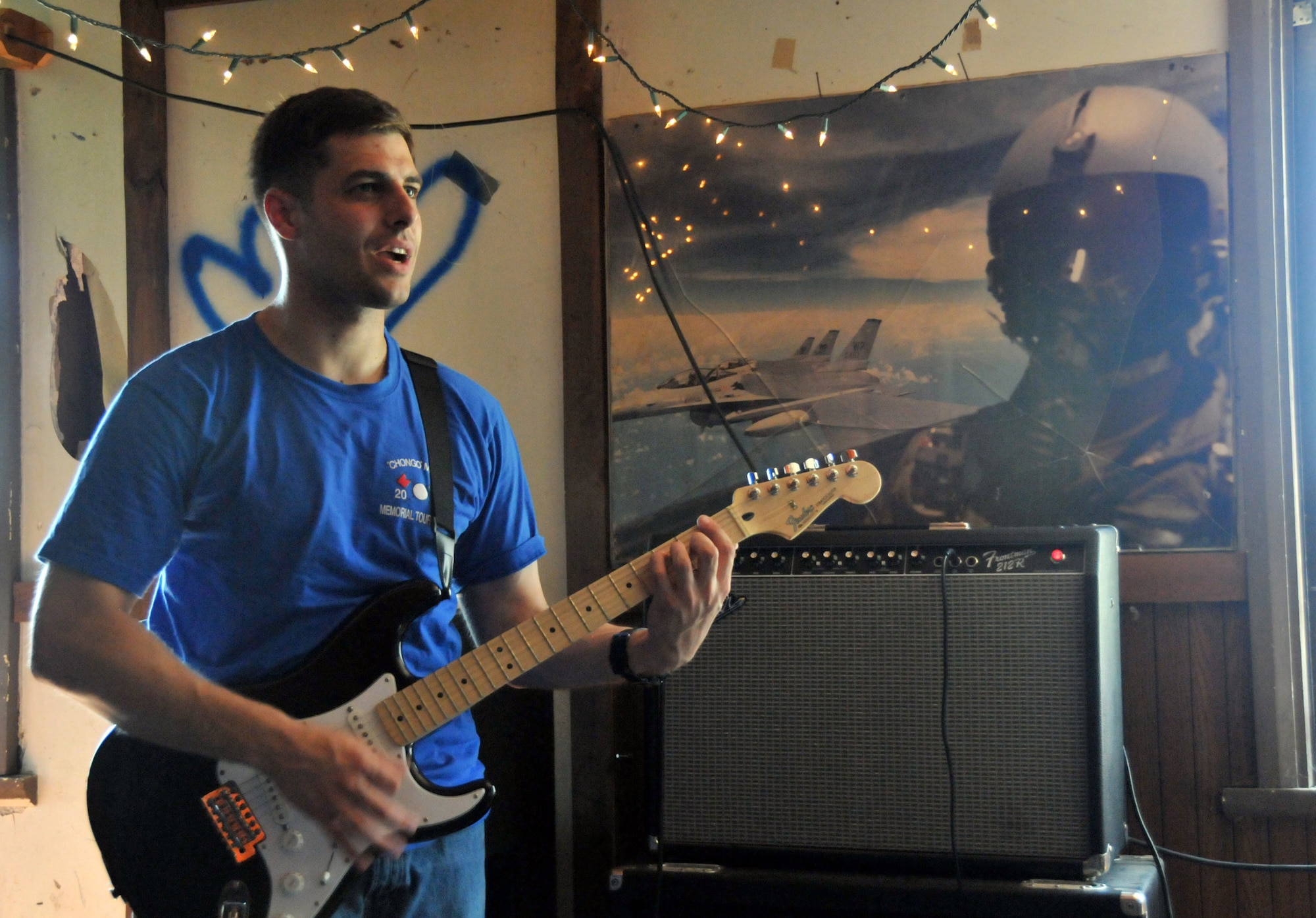 Capt. Brad "Emcon" Brizek takes on lead guitar during band practice at Delta here at Kunsan Air Base, Republic of Korea, Aug. 9, 2009. Captain Brizek is a pilot with the 35th Fighter Squadron "Pantons," and a member of the Steal Wool band. He's been playing guitar for more than seven years.  