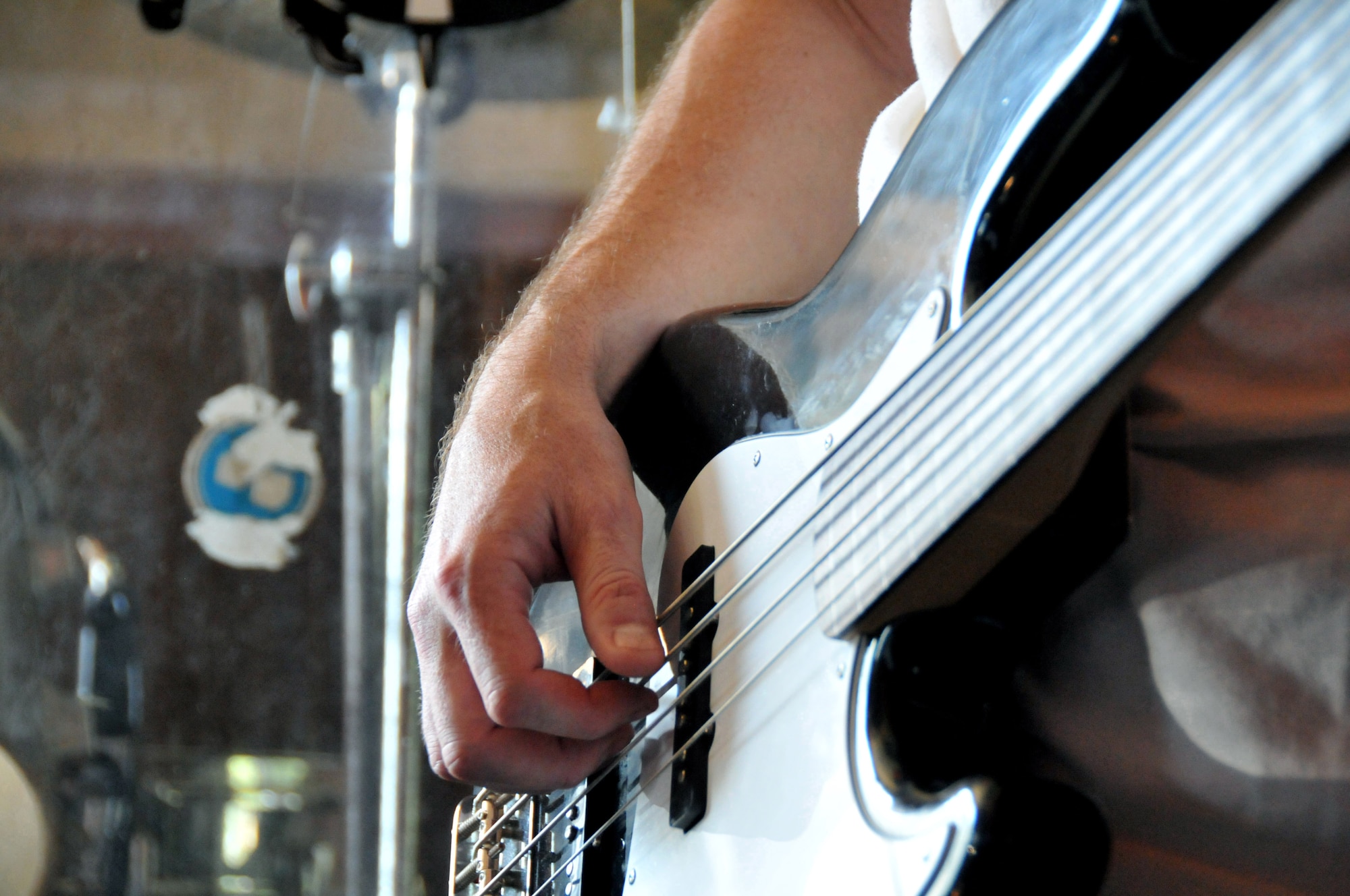 Lt. Col. Steve "Dallas" Horton strums the bass during practice at Delta here at Kunsan Air Base, Republic of Korea, Aug. 9, 2009. He is a pilot with the 35th Fighter Squadron "Pantons," and a member of the squadron's Steal Wool band. 