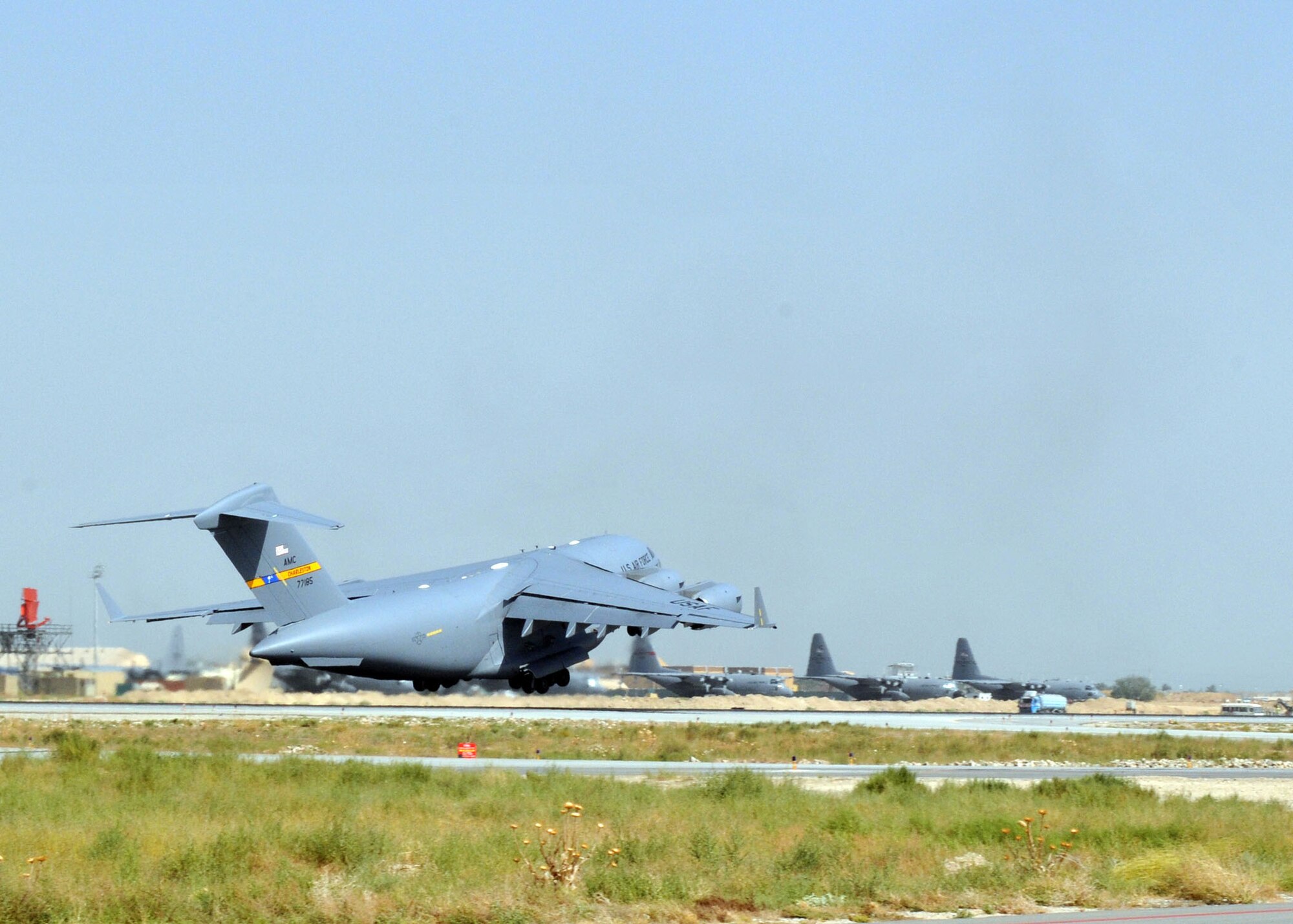 BAGRAM AIRFIELD, Afghanistan -- A C-17 Globemaster III from Charleston Air Force Base, S.C., takes off for a mission in support of Operation Enduring Freedom here, Aug. 30, 2009.  The aircraft can perform tactical airlift and airdrop missions and can also transport litters and ambulatory patients during aeromedical evacuations when required.  (U.S. Air Force photo/Senior Airman Felicia Juenke)