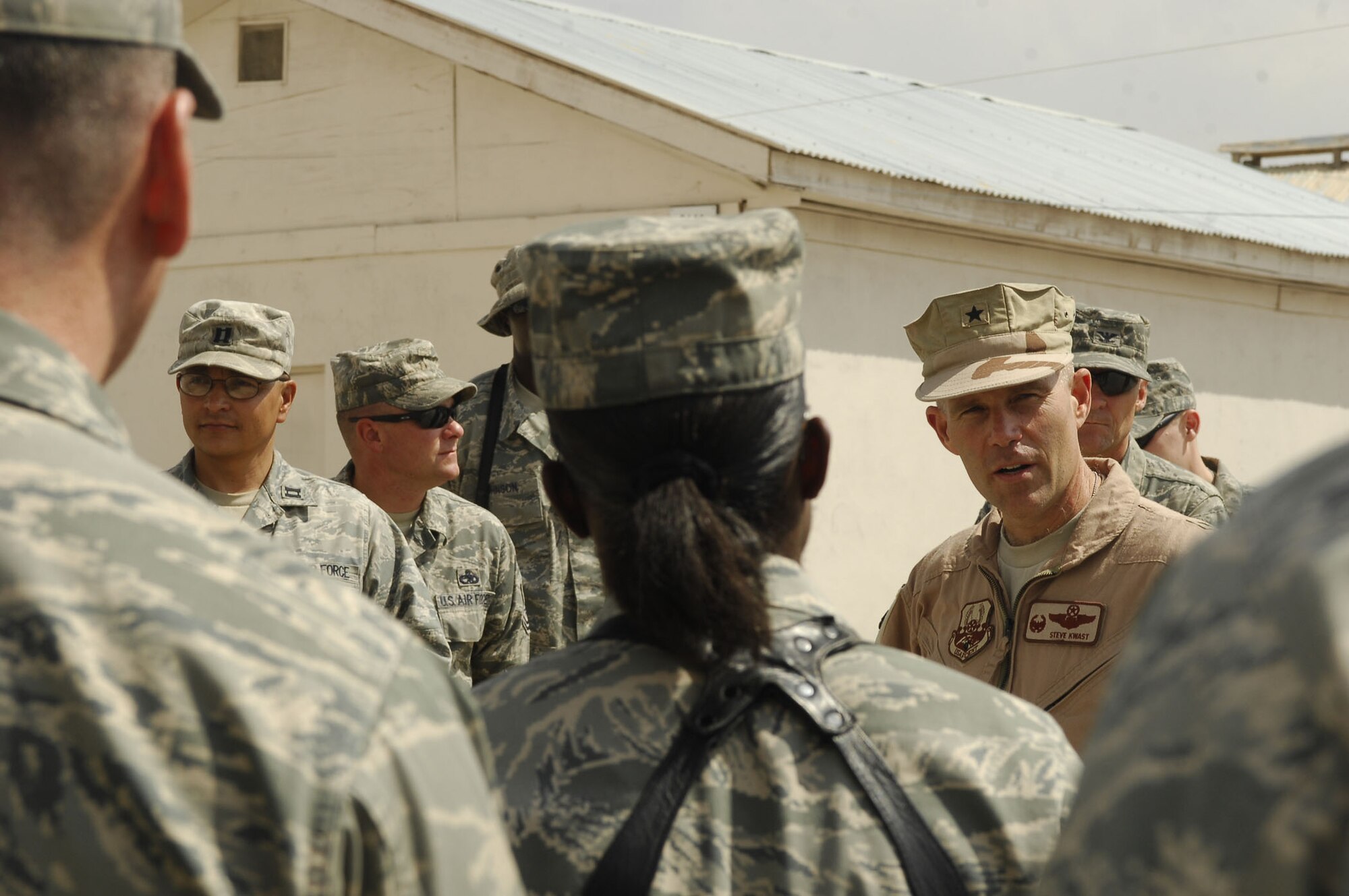 FORWARD OPERATING BASE LIGHTNING - Brig. Gen. Steve Kwast, 455th Air Expeditionary Wing commander, thanks dozens of Airmen here Aug. 30, 2009 in a make-shift "commander's call."  The Airmen are assigned to FOB Lightning as Joint Expeditionary Tasked Airmen who work day to day for U.S. Army commanders while they're also administratively assigned to U.S. Air Force commanders under the 755th Air Expeditionary Group at Bagram Airfield, Afghanistan.  The JET Airmen are part of the Embedded Training Team, which mentors Afghan National Army Forces in many skills to include medical and public affairs. The visit by Air Force leaders was designed to check up on Airman morale and readiness, while also thanking the Airmen for their work in the remote part of Afghanistan. (U.S. Air Force photo/Capt. David Faggard)