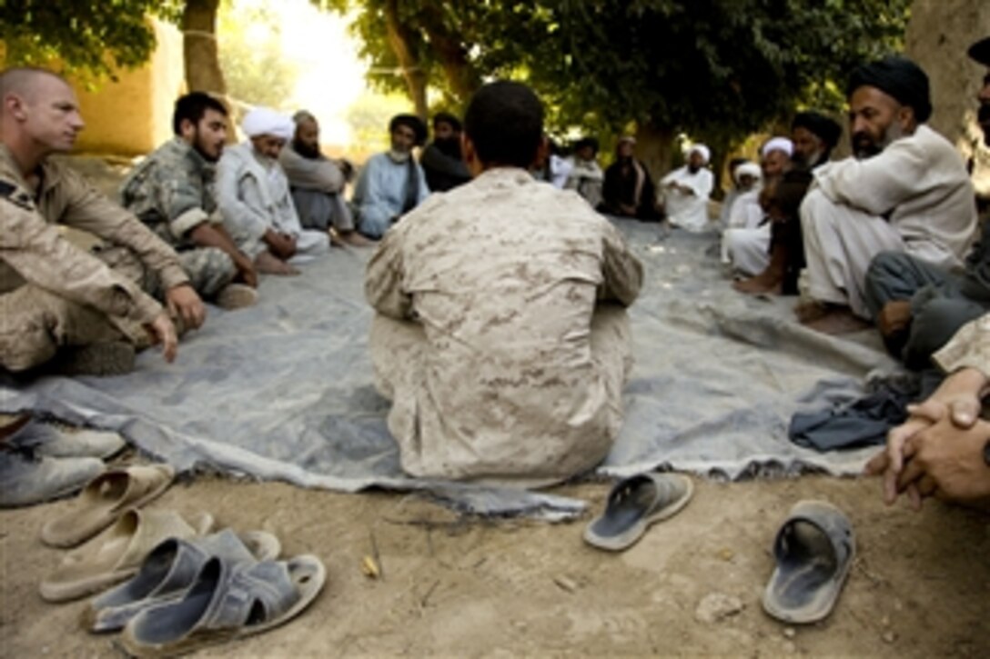 Local elders and U.S. Marines with Charlie Company, 1st Battalion, 5th Marine Regiment hold a meeting in Nawa district, Helmand province, Afghanistan, on Aug. 29, 2009.  The meeting was aimed at addressing security issues and improvised explosive device awareness for the locals.  The 1st Battalion is deployed with Regimental Combat Team 3 to conduct counterinsurgency operations in partnership with the Afghan security forces in southern Afghanistan.  