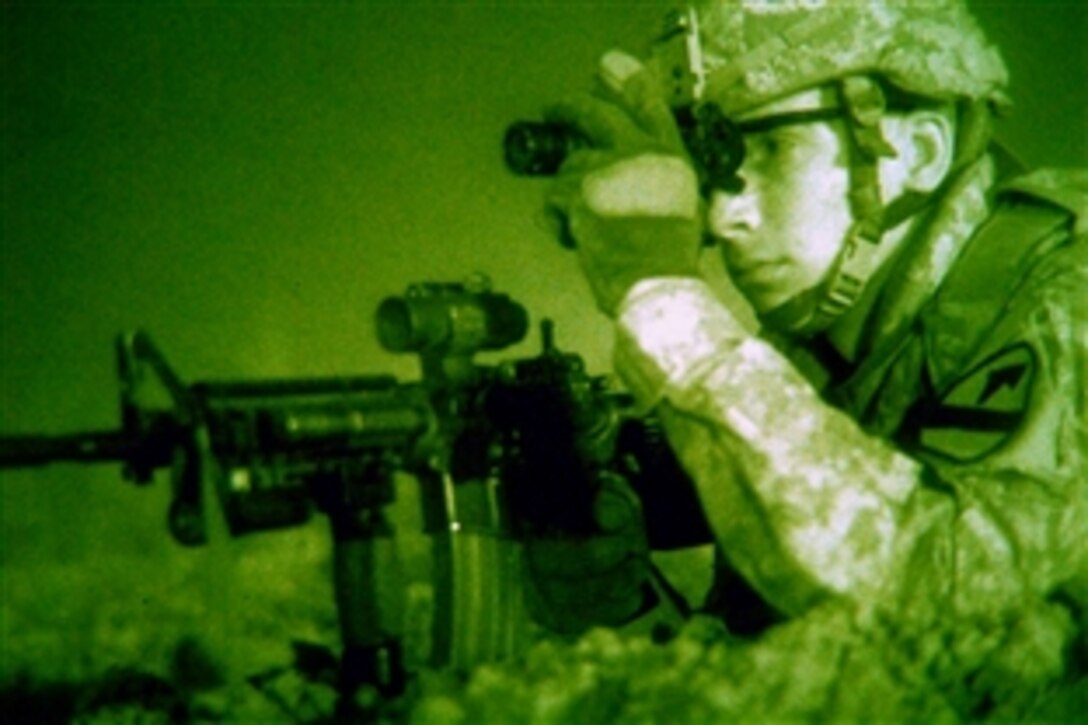 As seen though a night-vision device, U.S. Army Pfc. Brendan Smitke uses his scope to check enemy activity during a patrol in Nassir Wa Salam, Sept. 1, 2009. Smitke is an infantryman assigned to the 1st Infantry Division's Company C, 2nd Battalion, 8th Cavalry Regiment, 2nd Brigade Combat Team.