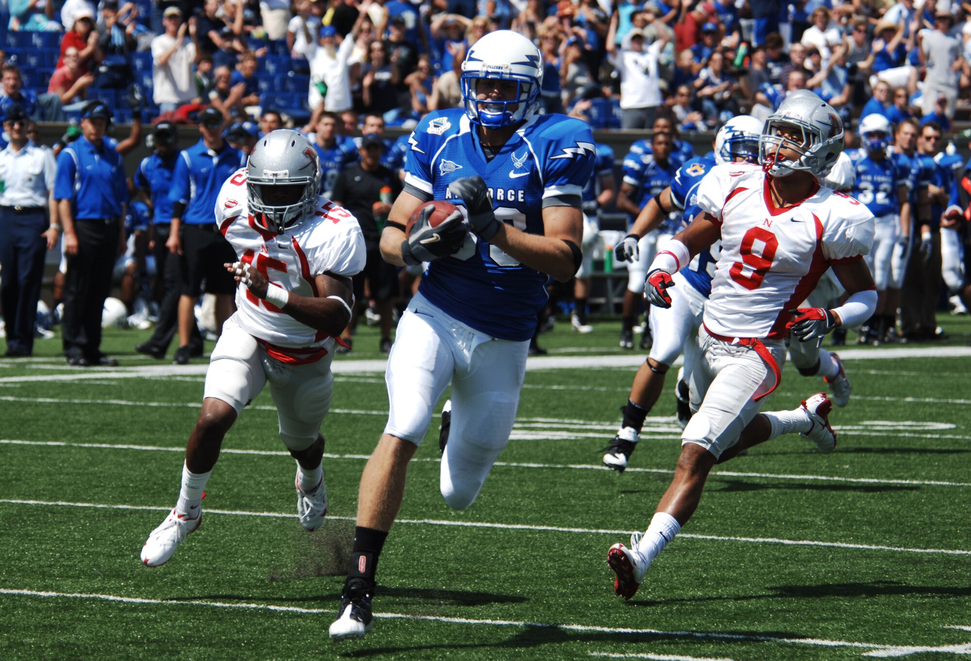 Falcons wide receiver Kevin Fogler breaks through the Nicholls State secondary for a 57-yard touchdown reception in Air Force's home opener at Falcon Stadium Sept. 5, 2009. Fogler, a junior and native of Fort Wayne, Ind., scored Air Force's only passing touchdown in its 72-0 victory against the Colonels. (U.S. Air Force photo/John Van Winkle)