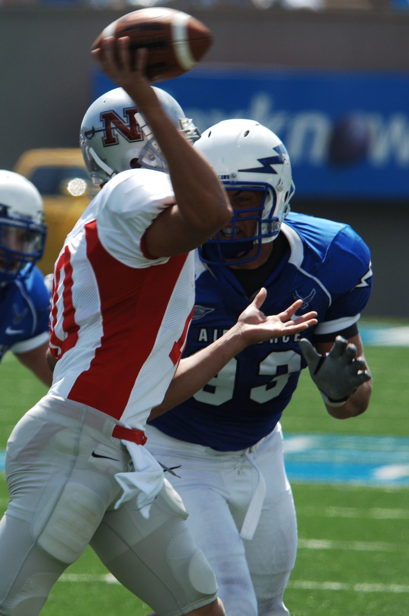 Falcons defensive lineman Ben Garland pressures Colonels quarterback Jake Witt during the Air Force-Nicholls State game at Falcon Stadium Sept. 5, 2009. Air Force won its home opener 72-0, handing Nicholls State its worst defeat in school history. Garland, a senior, is a native of Grand Junction, Colo. Witt, a red shirt freshman, is from Denton, Texas. (U.S. Air Force photo/John Van Winkle)