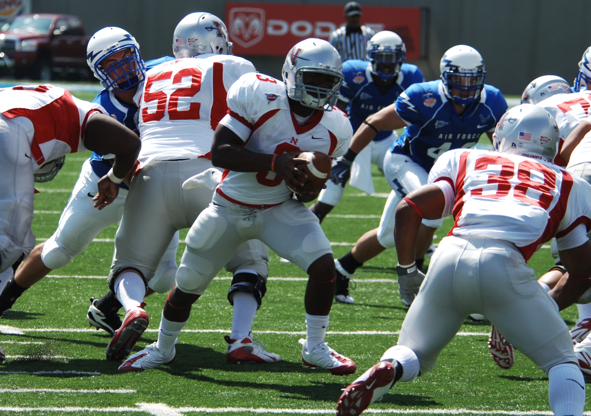 Nicholls State quarterback LaQuintin Caston hands the ball to runningback Corey Buchanan during the first half of the Falcons-Colonels game at Falcon Stadium Sept. 5, 2009. Air Force defeated Nicholls State 72-0, scoring 24 of its points on four Colonels fumbles. (U.S. Air Force photo/John Van Winkle)