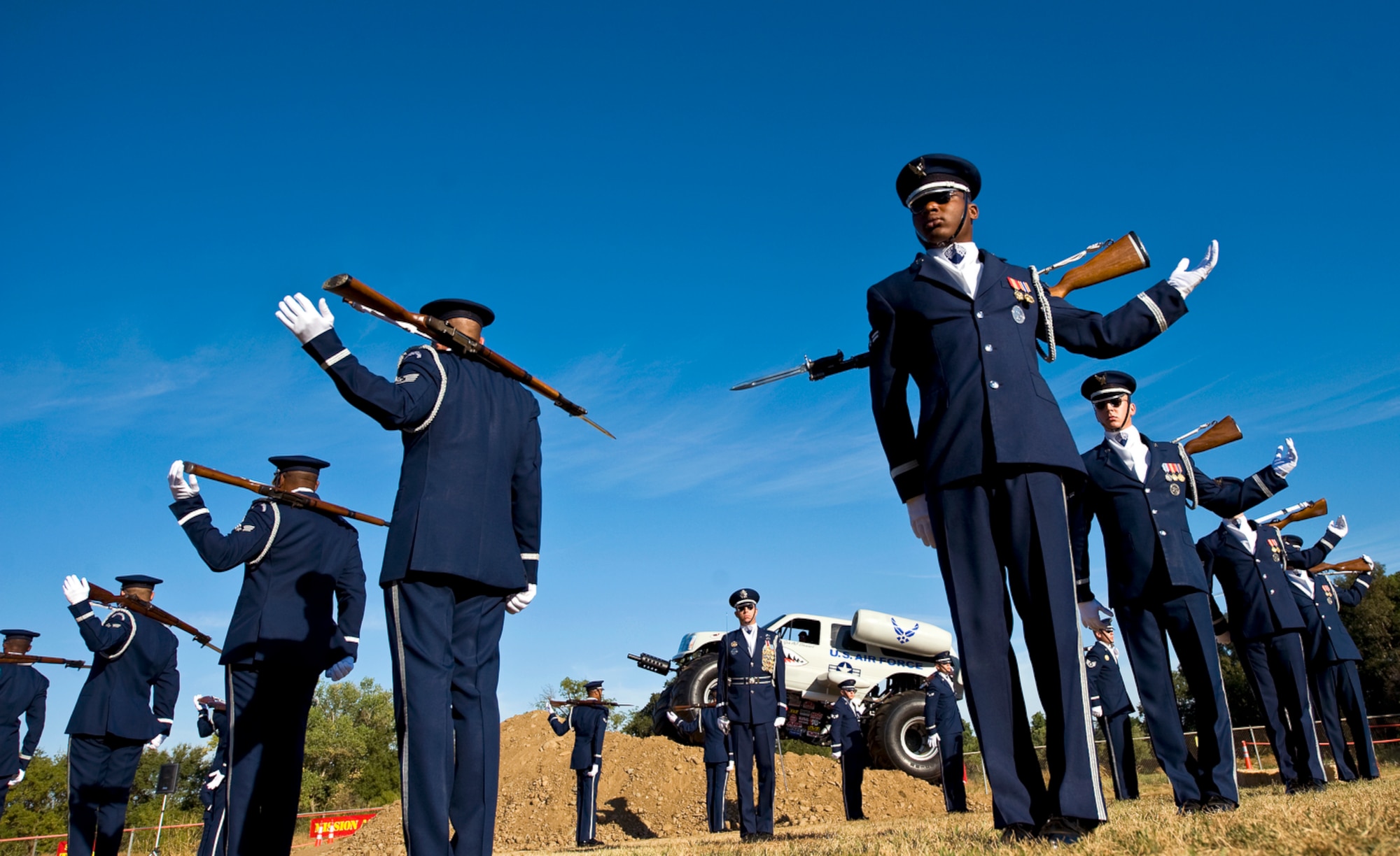 The United States Air Force Honor Guard Drill Team performs during the 10th Annual Mather Mud Run in Rancho Cordova, Calif., Sept. 5, 2009, for Air Force Week Sacramento. The Air Force Week is an event using various activities and exhibitions to educate the local community about the Air Force's capabilities and missions. (U.S. Air Force photo/Staff Sgt. Bennie J. Davis III) 