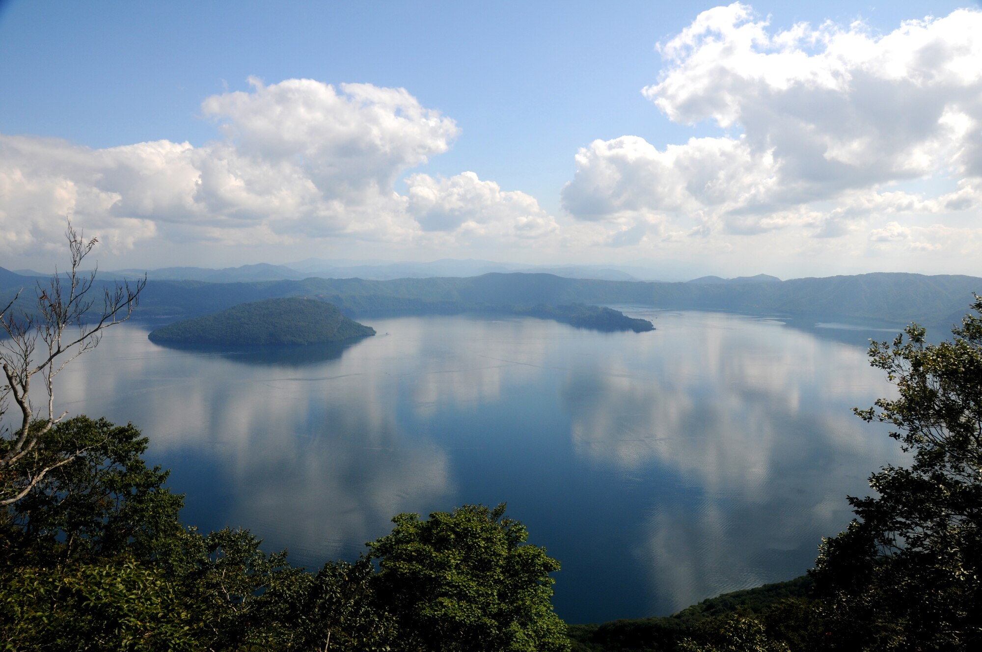 The mountains surrounding Lake Towada provide an overlook of one of the deeper portions of the lake, Sept. 5, 2009. Lake Towada is about an hour drive away from Misawa Air Base, at the end of popular route that takes visitors along the Oraise Gouge. (U.S. Air Force photo/2nd Lt. Jeff M. Nagan)

