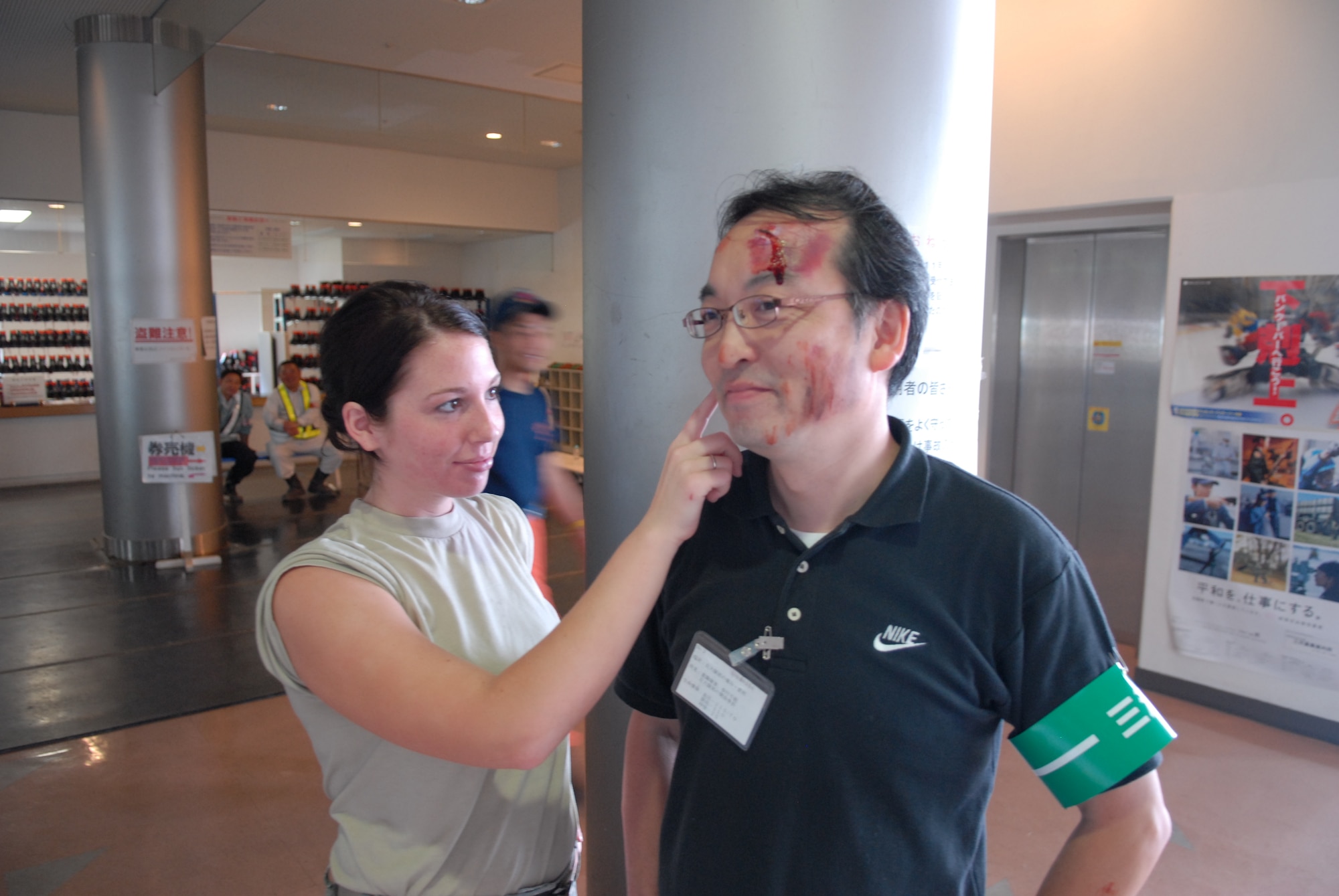MISAWA AIR BASE, Japan -- Airman 1st Class Sarah Williams, 35th Medical Dental Squadron dental lab technician, makes final touches to one of the Japanese volunteers Aug. 29 during the 2009 Aomori Prefecture Disaster Readiness Exercise. To make the exercise realistic, Misawa dental lab technicians made-up volunteers to appear as if they were really injured. (Air Force photo/Staff Sgt. Phillip Butterfield)  