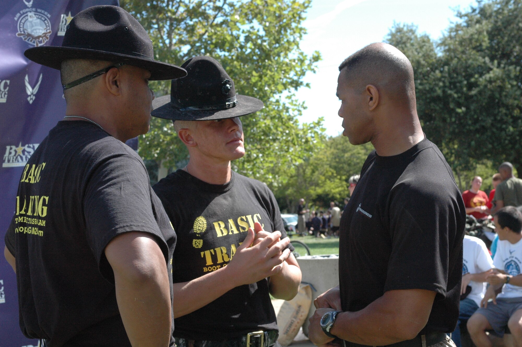 Three Marine Corps drill instructors prepare for the start of the Air Force Week Mather Mud Run Sept. 5 at Hagan Park in Rancho Cordova. (U.S. Air Force photo/ Senior Master Sgt. David Byron)