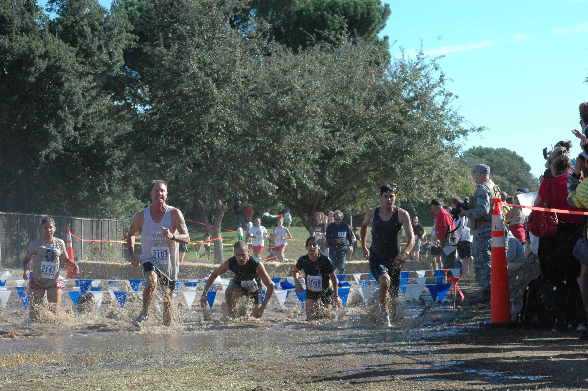 Team Travis members as well as community members participate in the Air Force Week Mather Mud Run Sept. 5 at Hagan Park in Rancho Cordova. The Mud Run featured a 5-mile and 2-mile obstacle course and boot camp challenge. (U.S. Air Force photo/Senior MAster Sgt. David Byron)