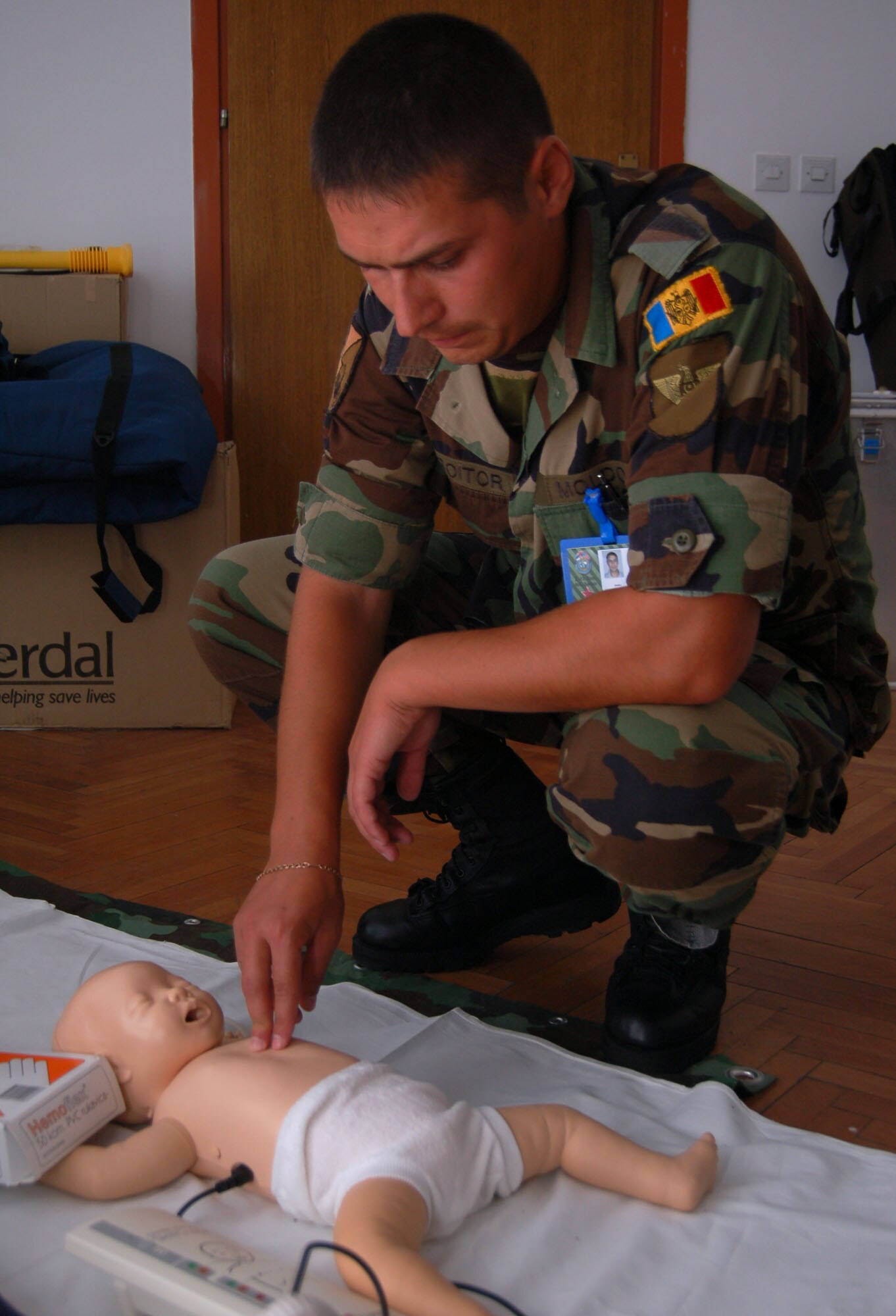 NIS, Serbia – Sergeant Alexandru Croitor, member of the Moldovan armed forces, practices providing cardiopulmonary resuscitation to an infant in a trauma nursing course Sept. 4 during the military medical training exercise in Central and Eastern Europe, or MEDCEUR 2009, in-class training portion. Members of 15 nations participated in the in-class, or didactics, segment of MEDCEUR 2009 prior to a live exercise scheduled for Sept. 9-11. (U.S. Air Force photo/Senior Airman Kali L. Gradishar)