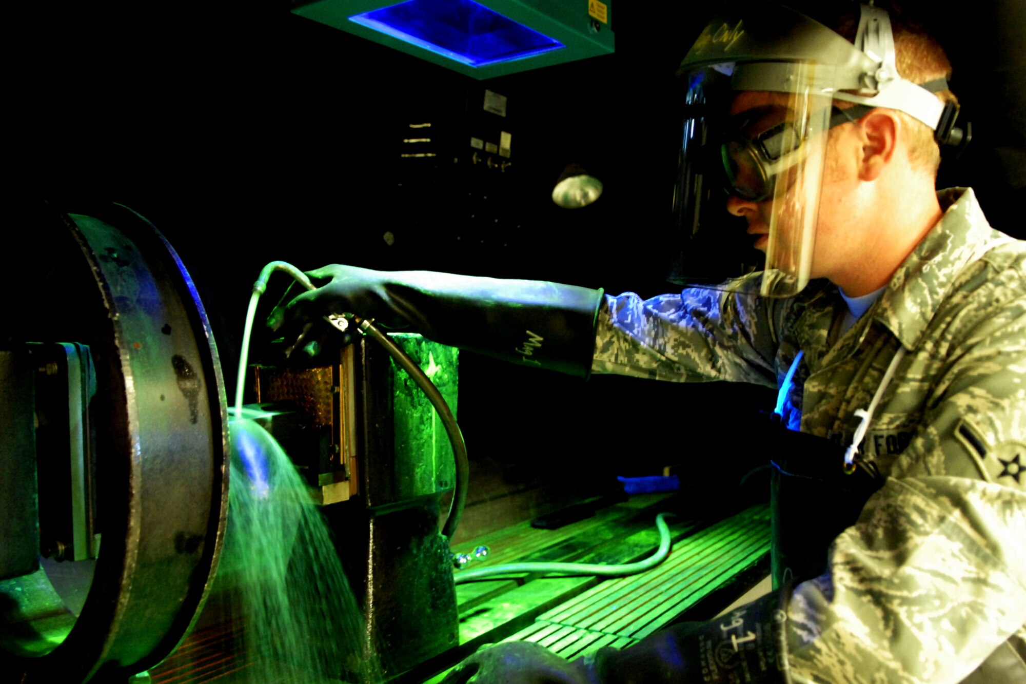 SPANGDAHLEM AIR BASE, Germany – Airman Francis Kane, 52nd Equipment Maintenance Squadron nondestructive inspector, performs a magnetic particle inspection on engine support equipment Sept. 3. This process aids in discovering defects and cracks on several types of equipment. (U.S. Air Force photo/Airman 1st Class Staci Miller)