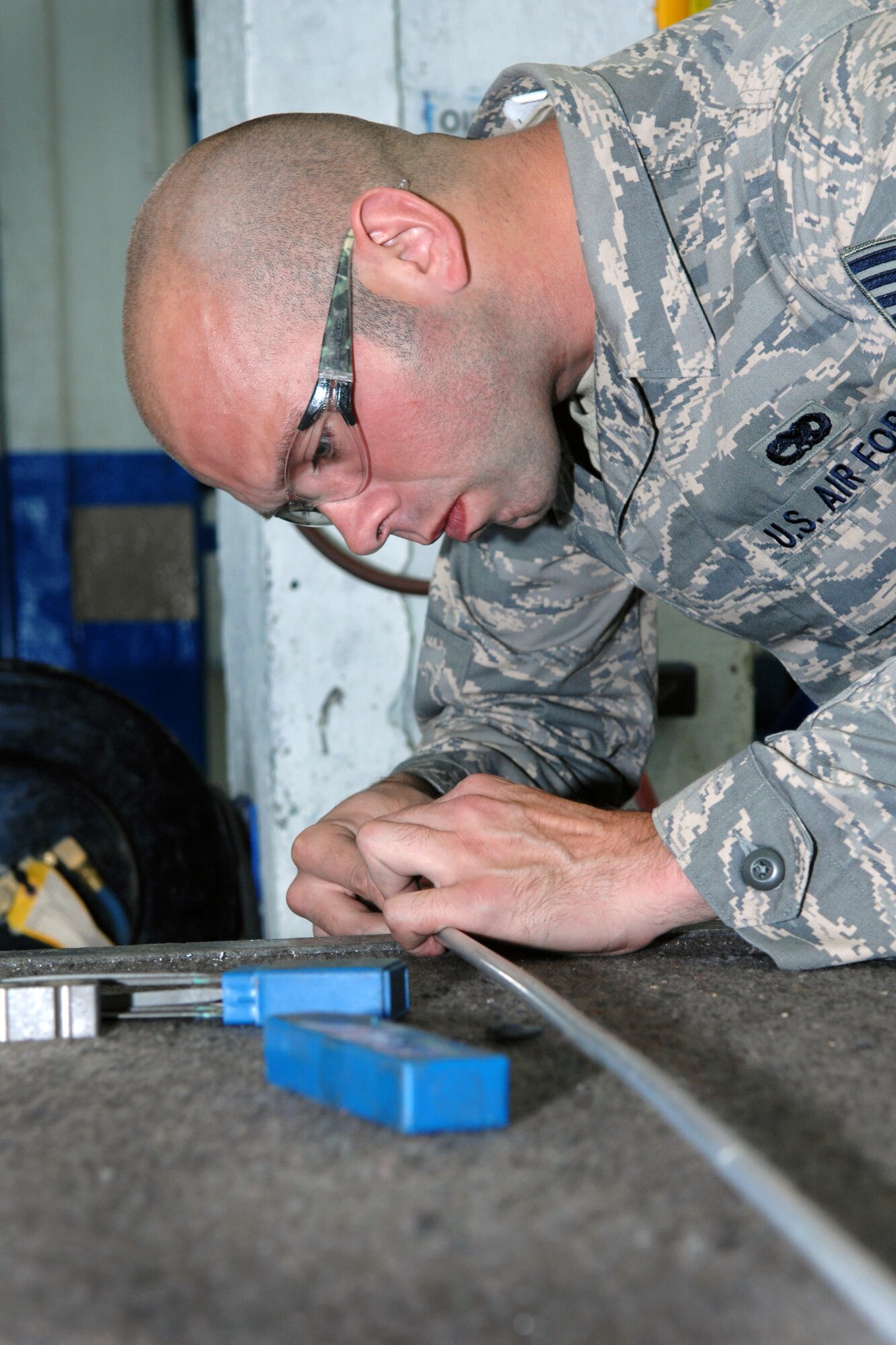 SPANGDAHLEM AIR BASE, Germany – Staff Sgt. Bryan Smith, 52nd Equipment Maintenance Squadron aircraft structural maintenance technician, works to create a leak-free seal on a fuel systems tubing line for an F-16 Fighting Falcon Sept. 3. Aircraft maintenance technicians cut, bend, and install hardware on all types of tubing. (U.S. Air Force photo/Airman 1st Class Staci Miller)