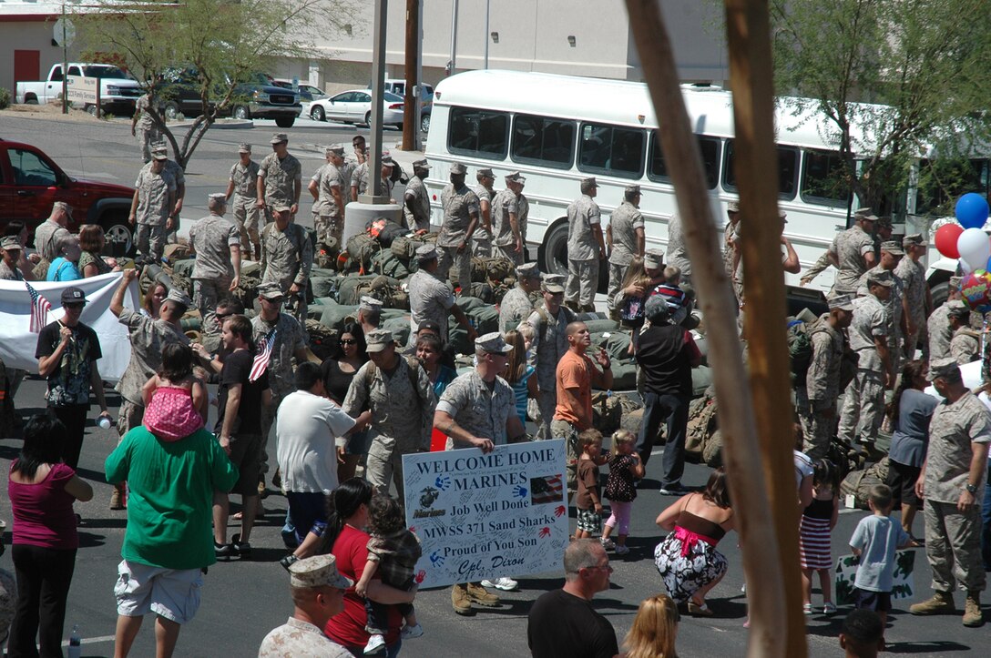 Marines from Marine Wing Support Squadron 371 unboard  buses Sept. 7, 2009, after returning to the Marine Corps Air Station in Yuma Ariz., from a seven-month deployment to Afghanistan. While on deployment, MWSS-371 provided aviation ground support, as well as logistics and engineering support to Marine Aircraft Group 40. The squadron constructed the largest aluminum matting airfield project in a combat zone when they built a 2.2 million square foot helicopter parking expansion at Camp Bastion, said Lt. Col. David Jones, MWSS-371 commanding officer.