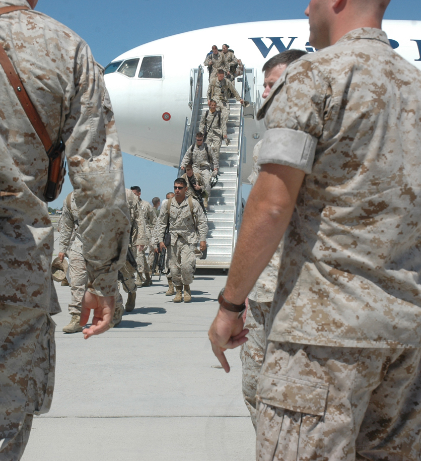 Marines from Marine Wing Support Squadron 371 disembark from a commercial airliner Sept. 7, 2009, after returning to the Marine Corps Air Station in Yuma Ariz., from a seven-month deployment to Afghanistan. While on deployment, MWSS-371 provided aviation ground support, as well as logistics and engineering support to Marine Aircraft Group 40. The squadron constructed the largest aluminum matting airfield project in a combat zone when they built a 2.2 million square foot helicopter parking expansion at Camp Bastion, said Lt. Col. David Jones, MWSS-371 commanding officer.