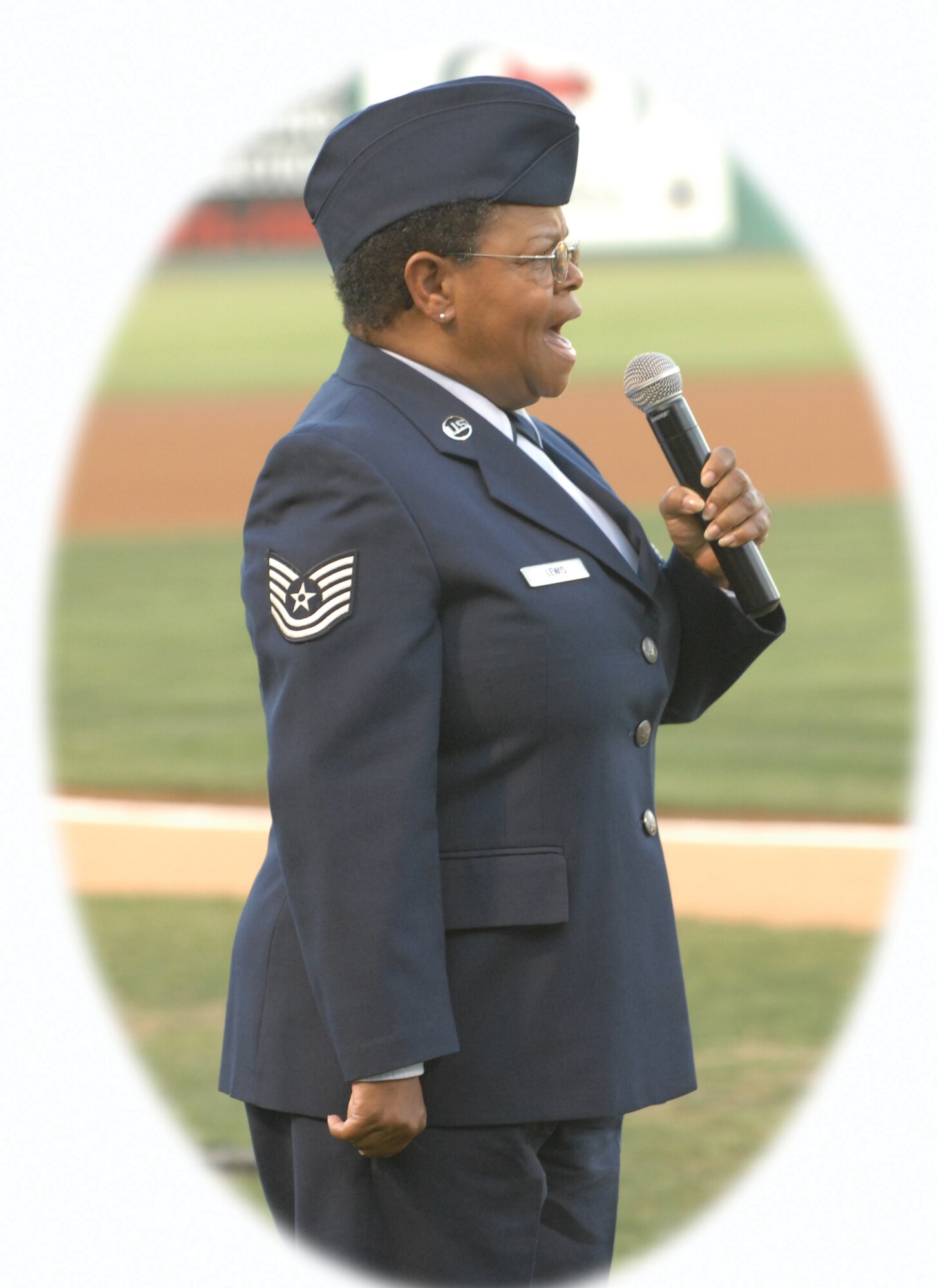 Tech. Sgt. Sue Lewis sings the National Anthem before the Lake Elsinore Storm baseball game on Aug. 22. (U.S. Air Force photo by Master Sgt. Roy Santana)