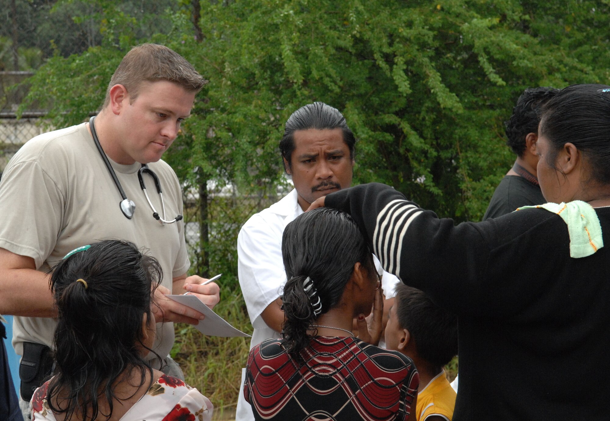 U.S. Air Force Capt. (Dr.) Christopher Lindshield, of the 374th Medical Group from Yokota Air Base, Japan, listens to a patient during the Humanitarian Assistance Rapid Response Team (HARRT) validation exercise Sept. 4, 2009, on Chuuk, in the Federated States of Micronesia.  The HARRT is the Air Force's new expeditionary medical capability designed to deploy within 24-hours of notice during disaster relief operations.  Based at Andersen Air Force Base, Guam, the team provides basic medical care and public health assistance to 350 to 500 patients per day.  (U.S. Air Force photo by Capt. Andrew Hoskinson)