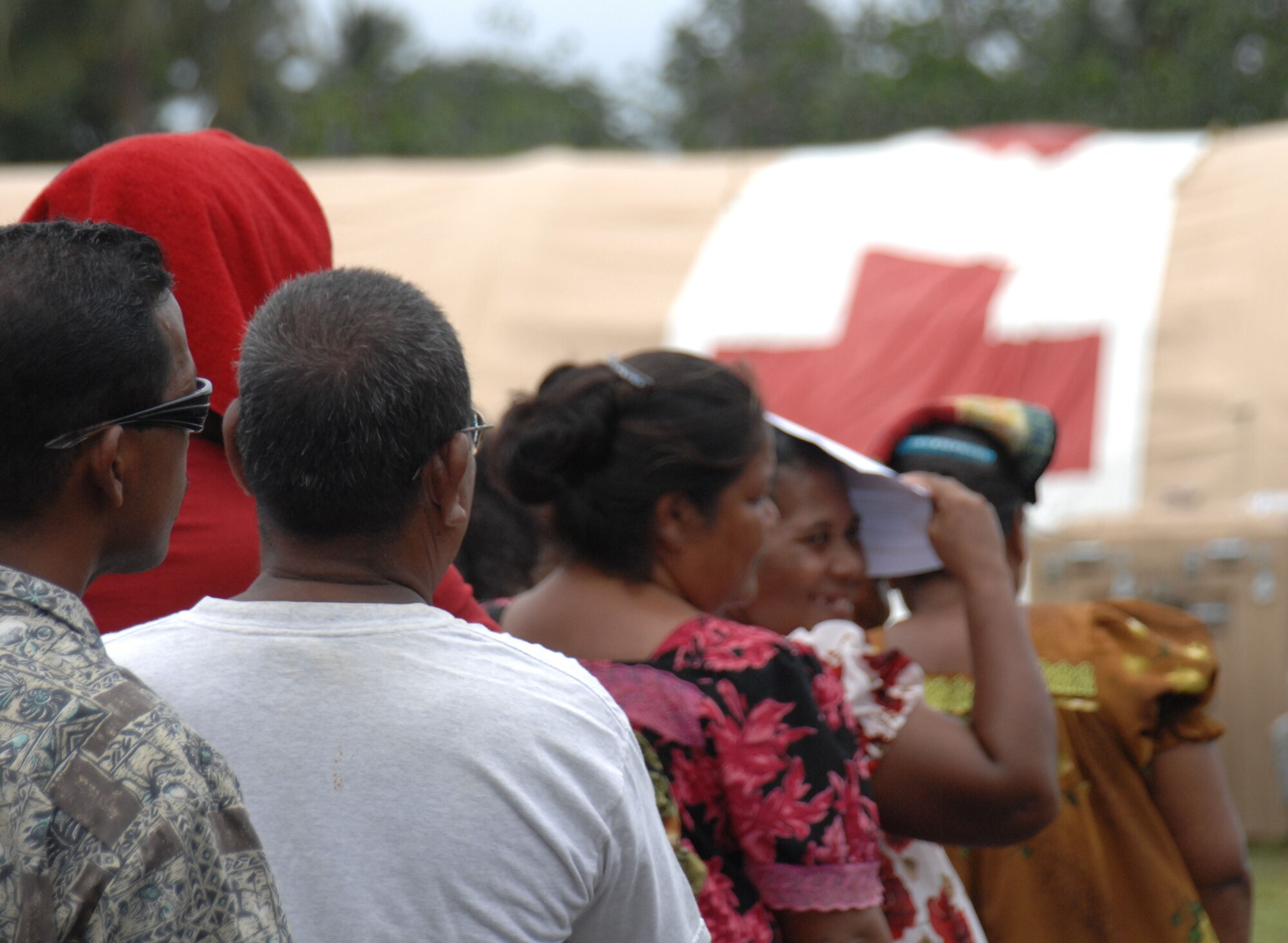 Chuukese citizens assemble before receiving treatment from the Humanitarian Assistance Rapid Response Team (HARRT) during a validation exercise Sept. 3, 2009, on Chuuk, in the Federated States of Micronesia.  The HARRT is the Air Force's new expeditionary medical capability designed to deploy within 24-hours for disaster relief operations.  Based at Andersen Air Force Base, Guam, the team provides basic medical care and public health assistance to 350-500 patients per day.  (U.S. Air Force photo by Capt. Andrew Hoskinson)
