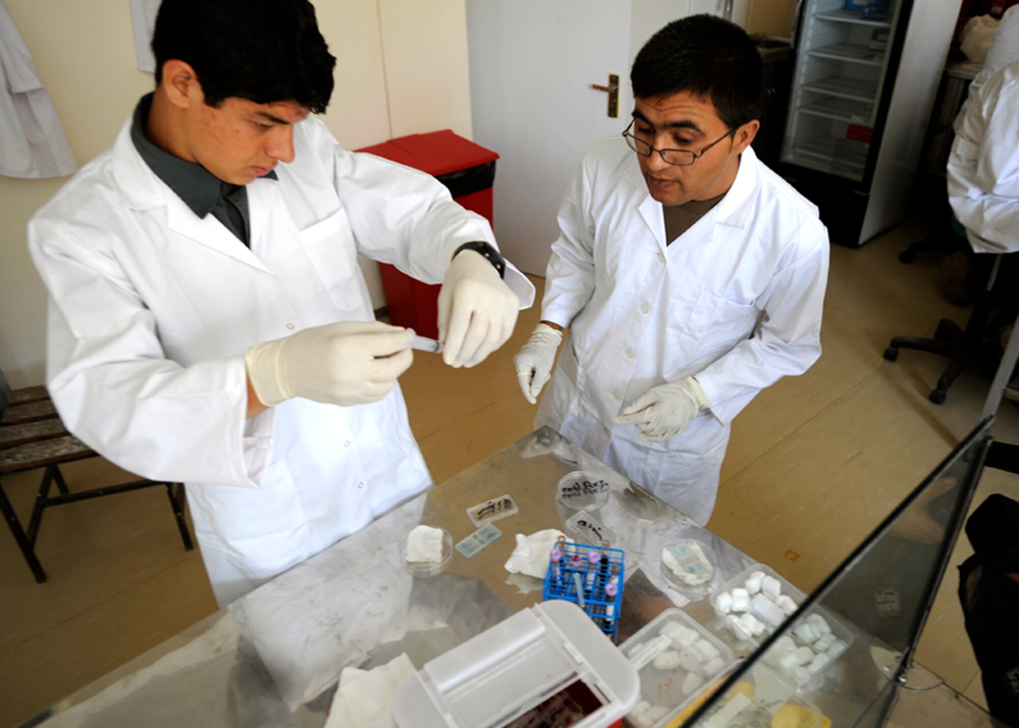Afghan medical students practice laboratory techniques Aug. 3, 2009 at the Kabul national military hospital in Kabul, Afghanistan. (U.S. Air Force photo by Staff Sgt. Shawn Weismille) 