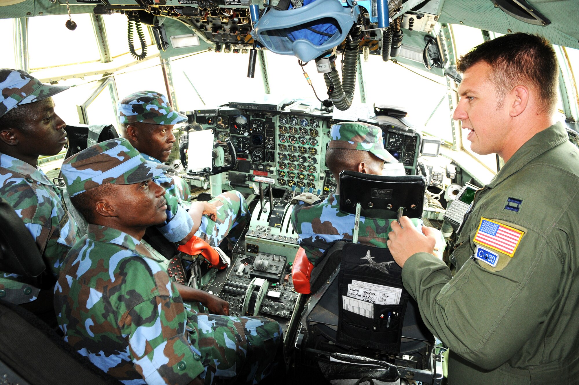 Capt. Kevin Graham gives a tour of the C-130 Hercules flight deck to members of the Ugandan peoples defense force during a theater security engagement event Aug. 26, 2009, at Entebbe Air Base, Uganda. (U.S. Air Force photo/Maj. Paula Kurtz) 